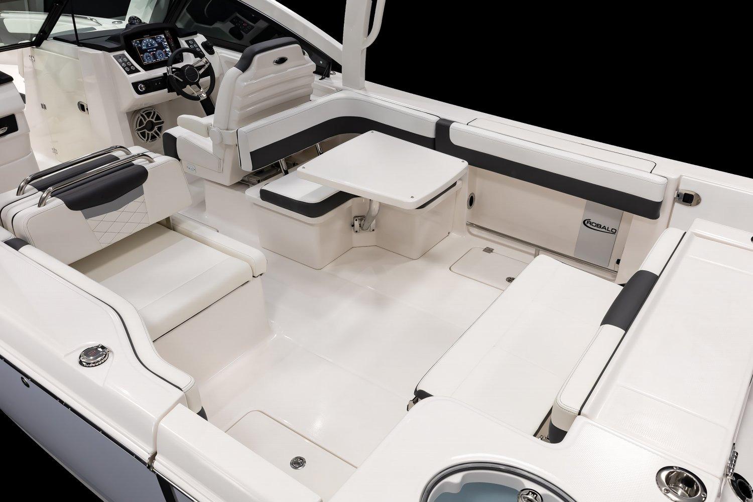 Manufacturer Provided Image: 2026 Robalo R277 Dual Console boat interior with white seating and modern dashboard.