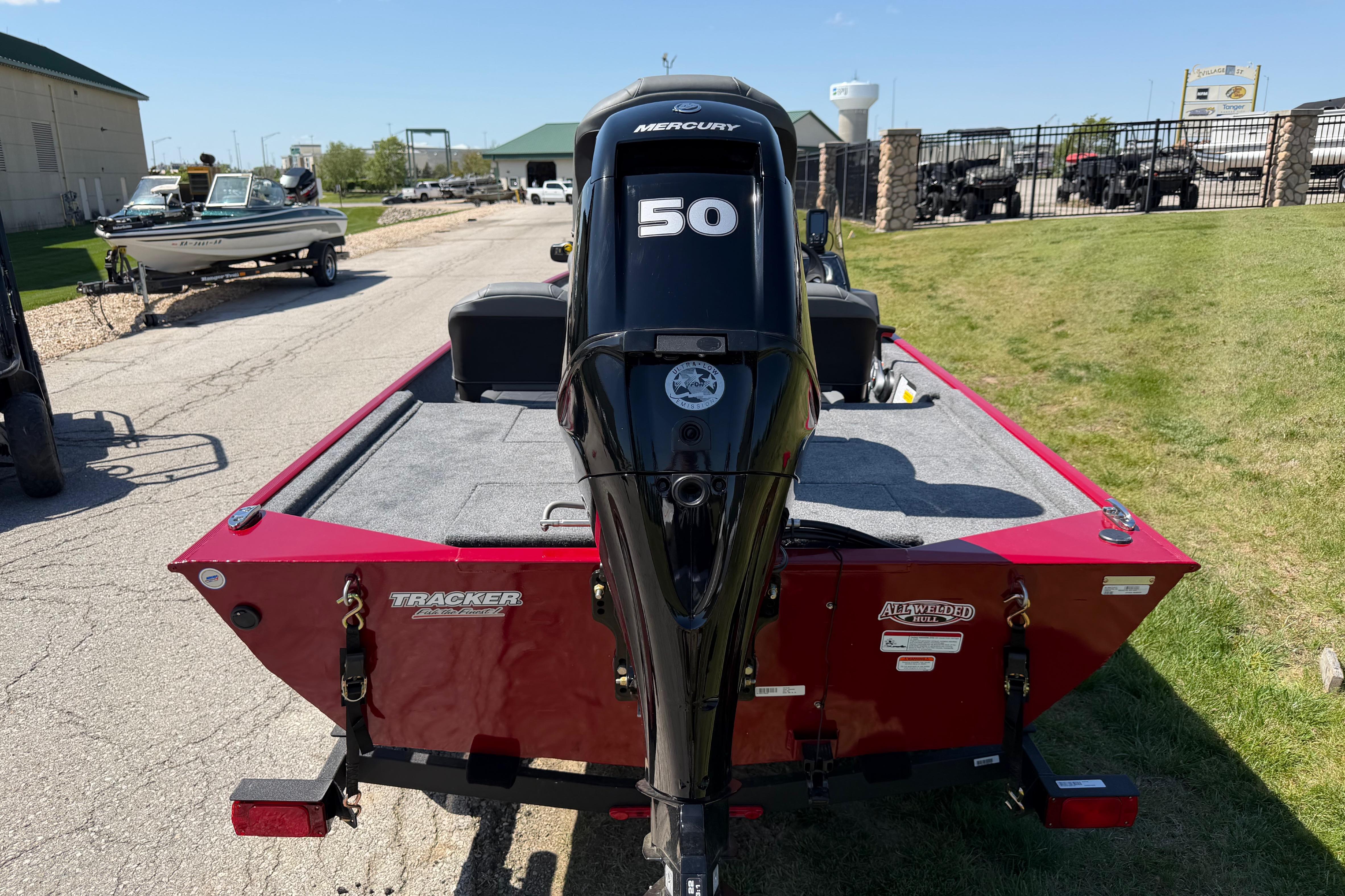 2026 Tracker Bass Tracker Classic XL boat with Mercury 50 engine, parked outdoors.