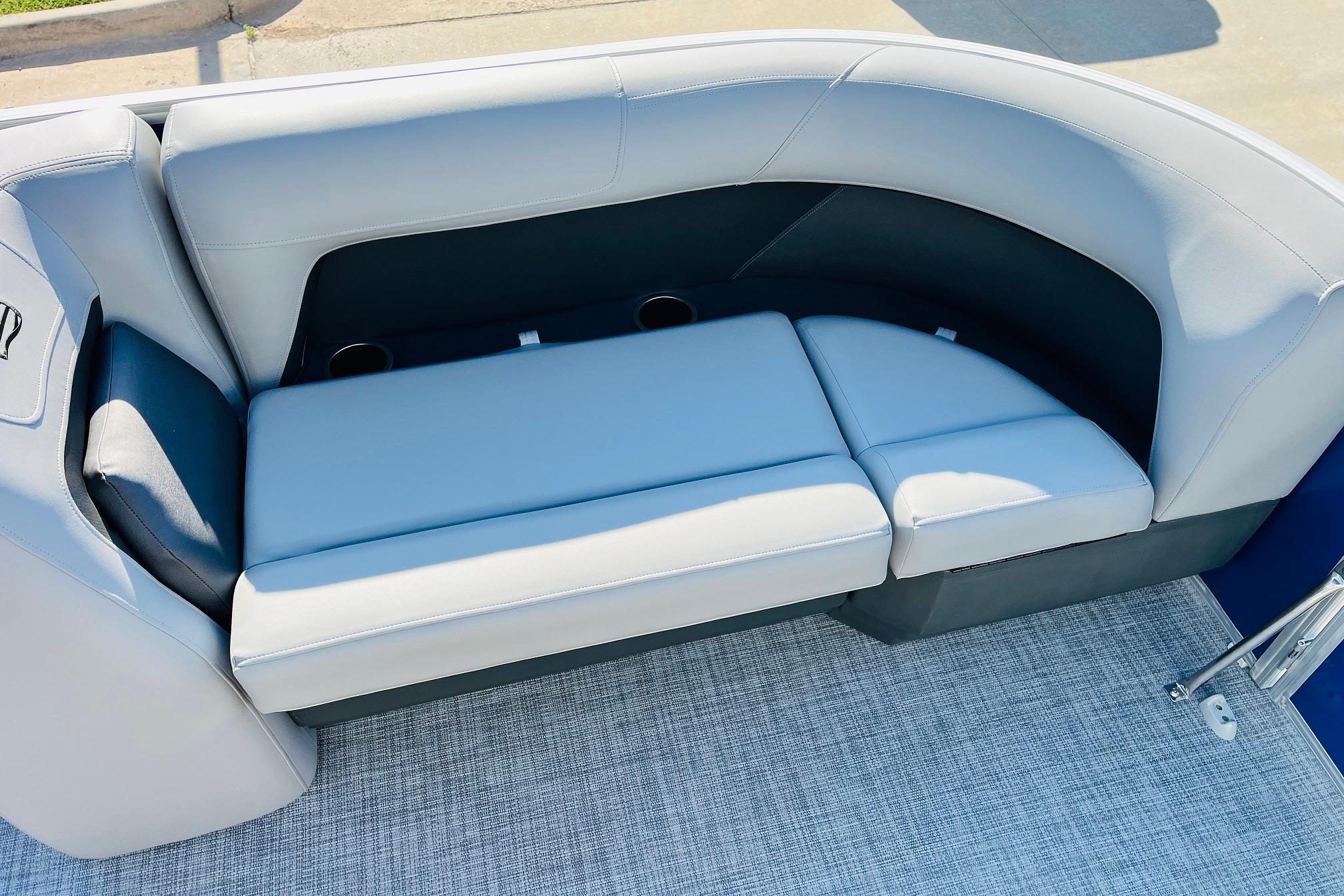 2026 Sun Tracker Party Barge 18 DLX with comfortable seating and cup holders.