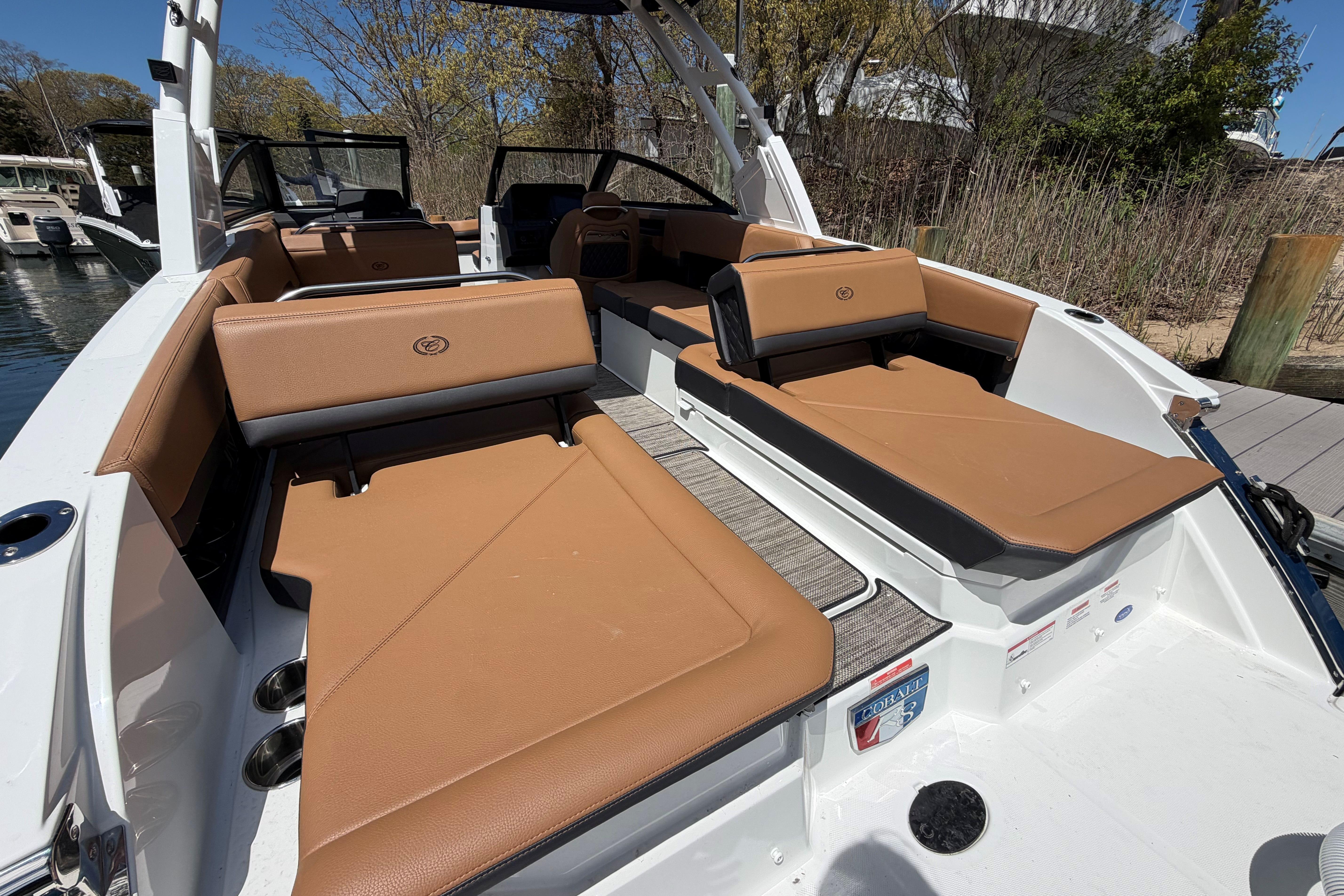 2026 Cobalt R8 Outboard boat with luxurious tan seating and sleek design.