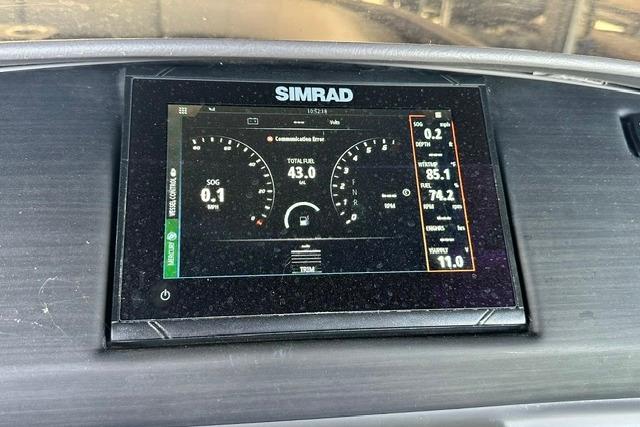 Simrad display on 2021 Bennington L Bowrider 25 Quad Bench showing navigation and fuel data.