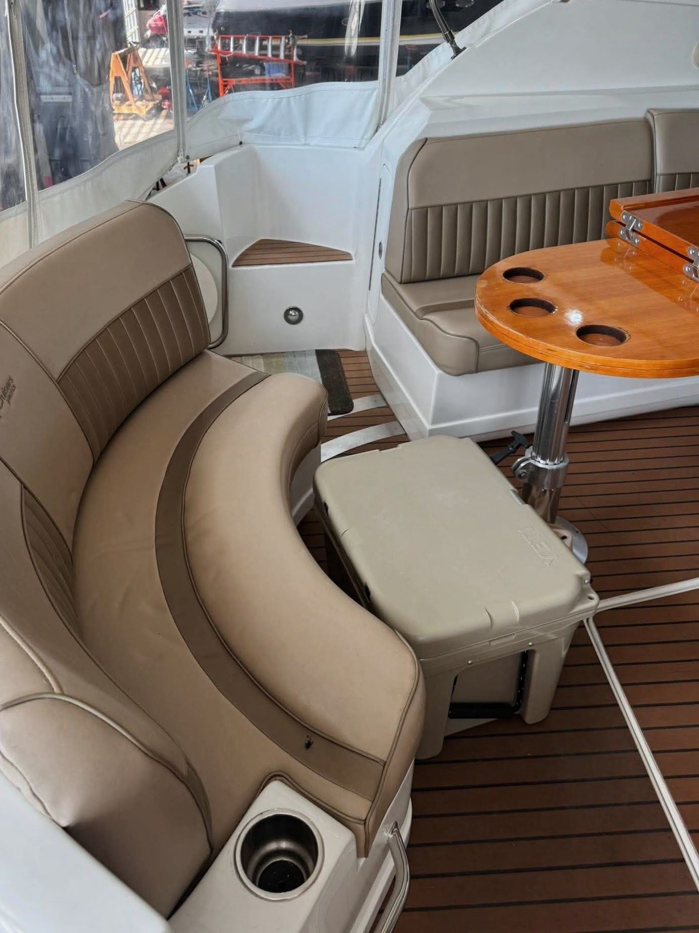 Interior of a 2009 Cruisers Yachts 520 Sports Coupe with elegant seating and a wooden table.