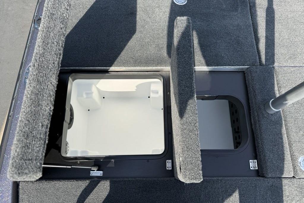 2026 Skeeter ZXE20 boat storage compartments with open hatches, showcasing interior design.