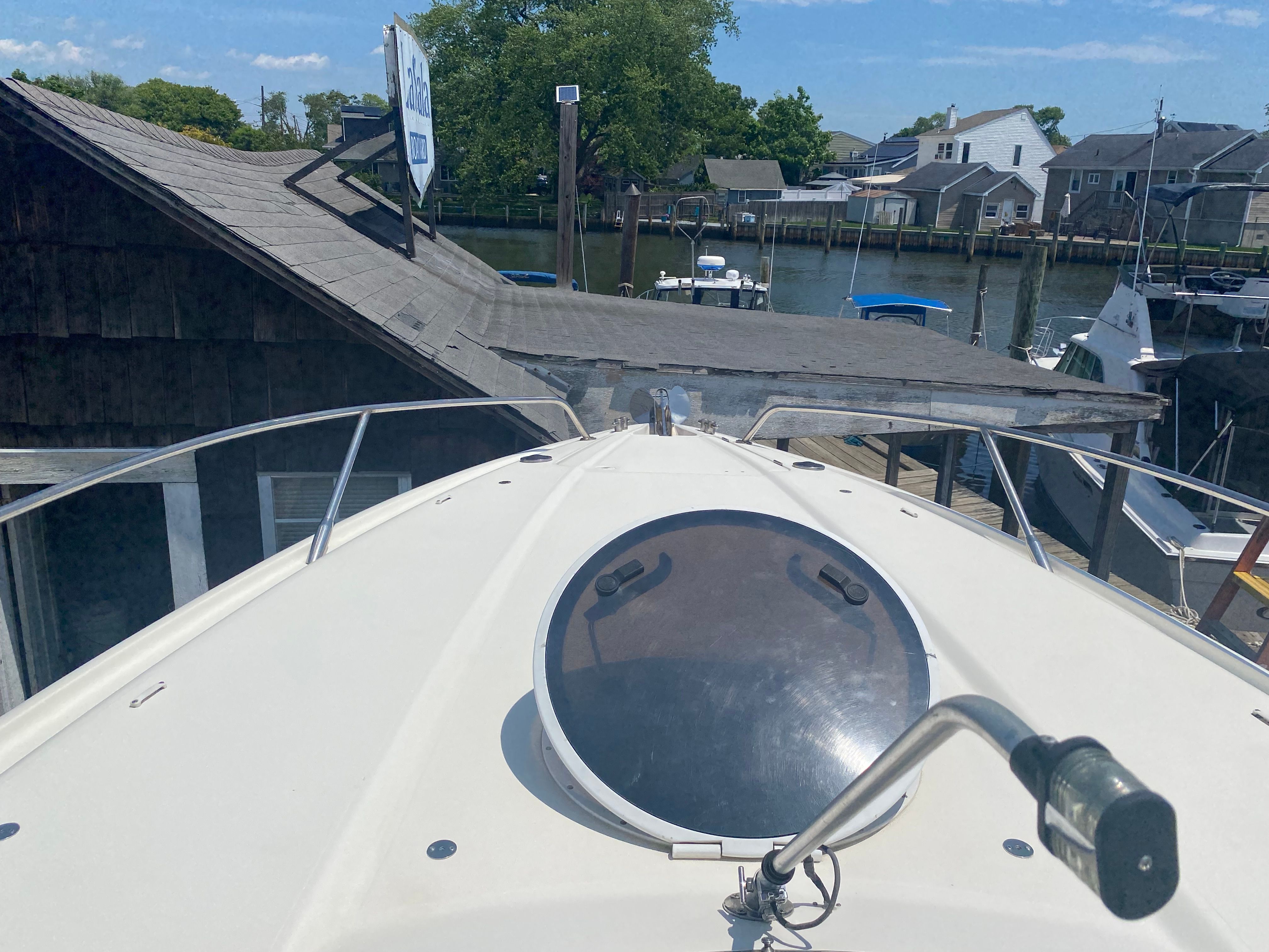 1994 Sunseeker Hawk 31 docked in a marina area.