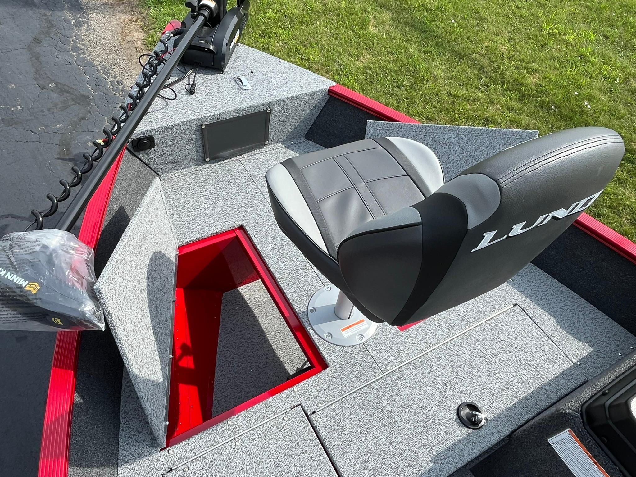 2026 Lund 1650 Angler SS boat interior with seat and storage compartment.