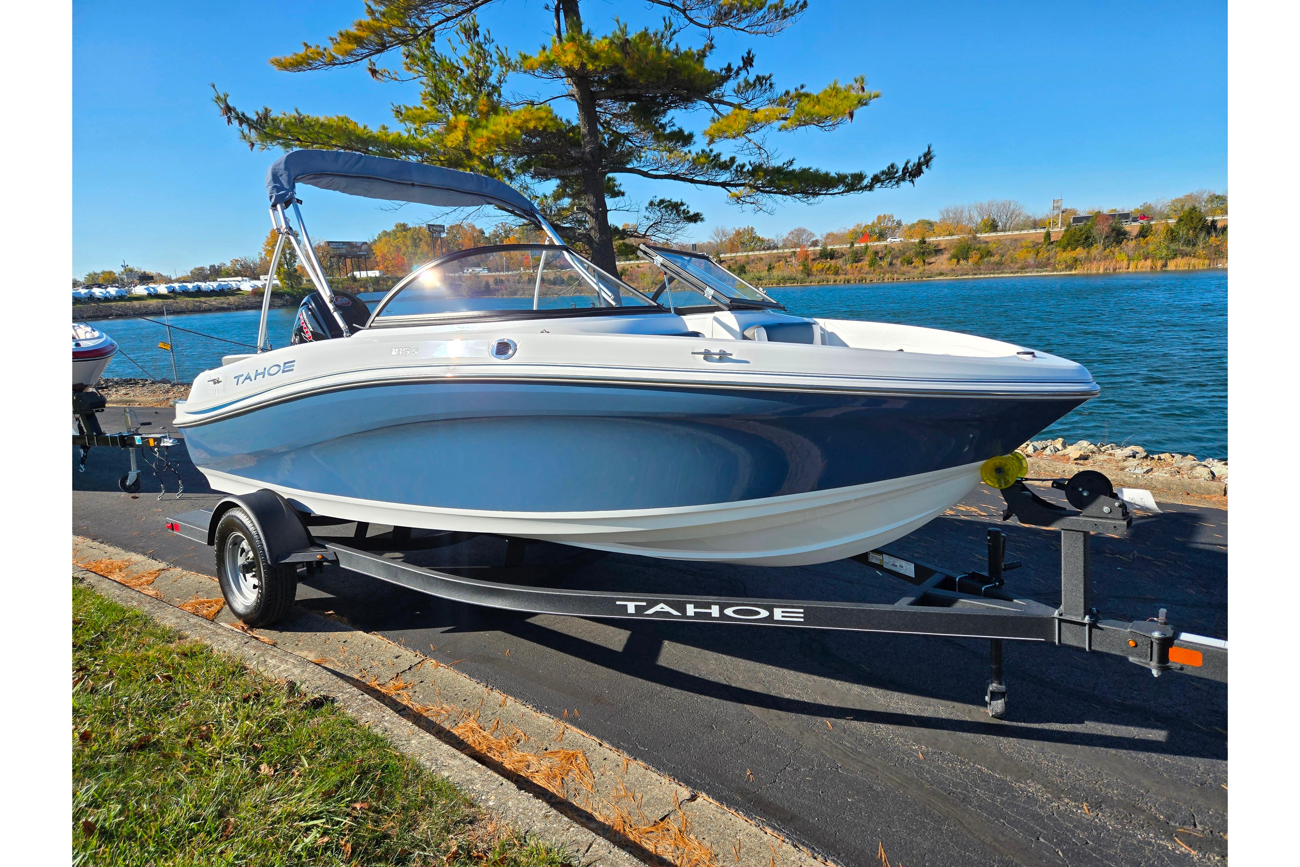 2023 Tahoe 185 S boat on trailer by a scenic lakeside.