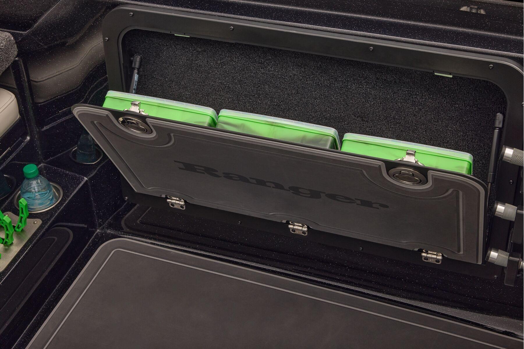Manufacturer Provided Image: 2026 Ranger 620xFS Pro boat storage compartment with green tackle boxes.