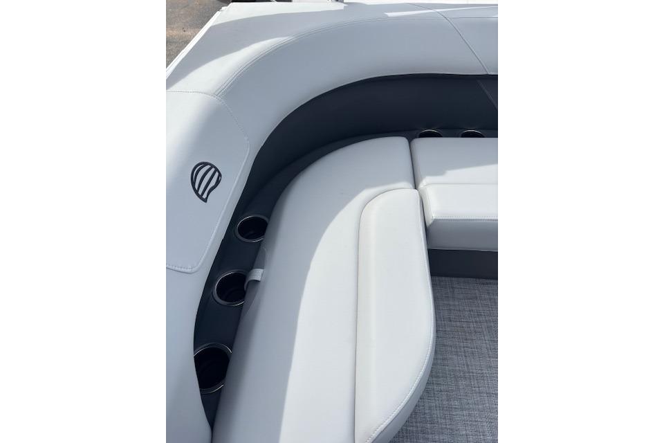 2026 Sun Tracker Party Barge 16 DLX interior seating with cup holders.