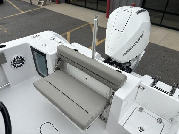 2025 Sportsman Open 232 boat with Mercury engine and foldable seating.
