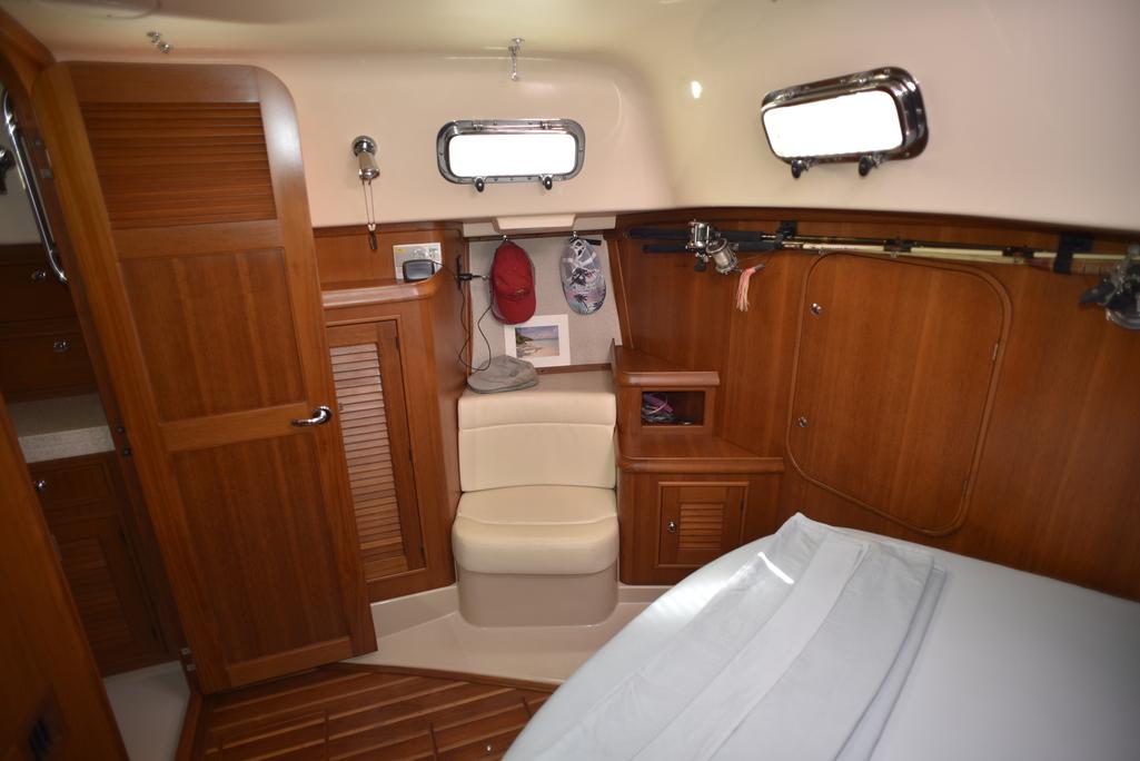 Interior of 2005 Island Packet 445 sailboat, featuring wooden cabinetry and seating.