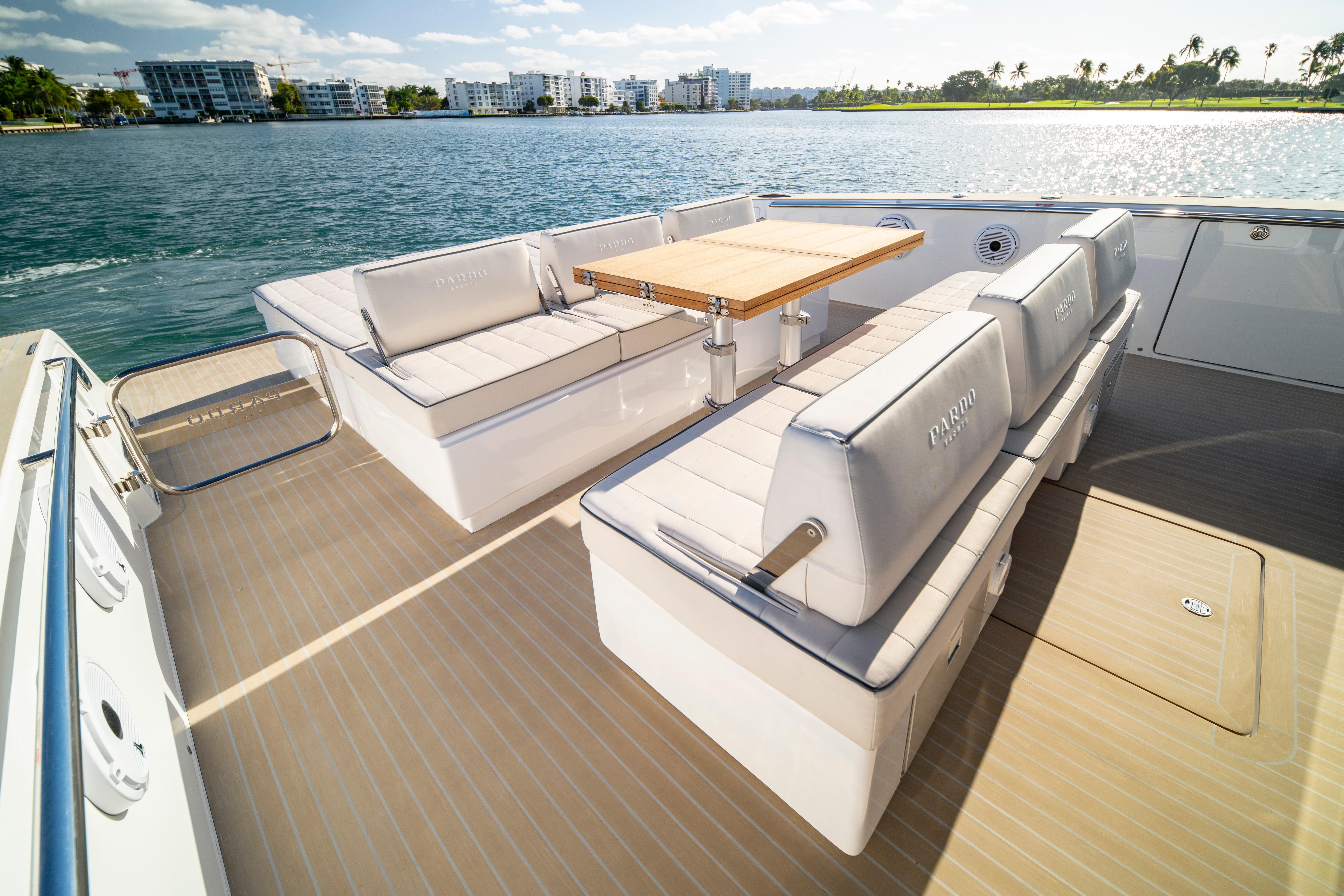 Luxurious 2024 Pardo Yachts P43 deck with elegant seating and scenic water view.