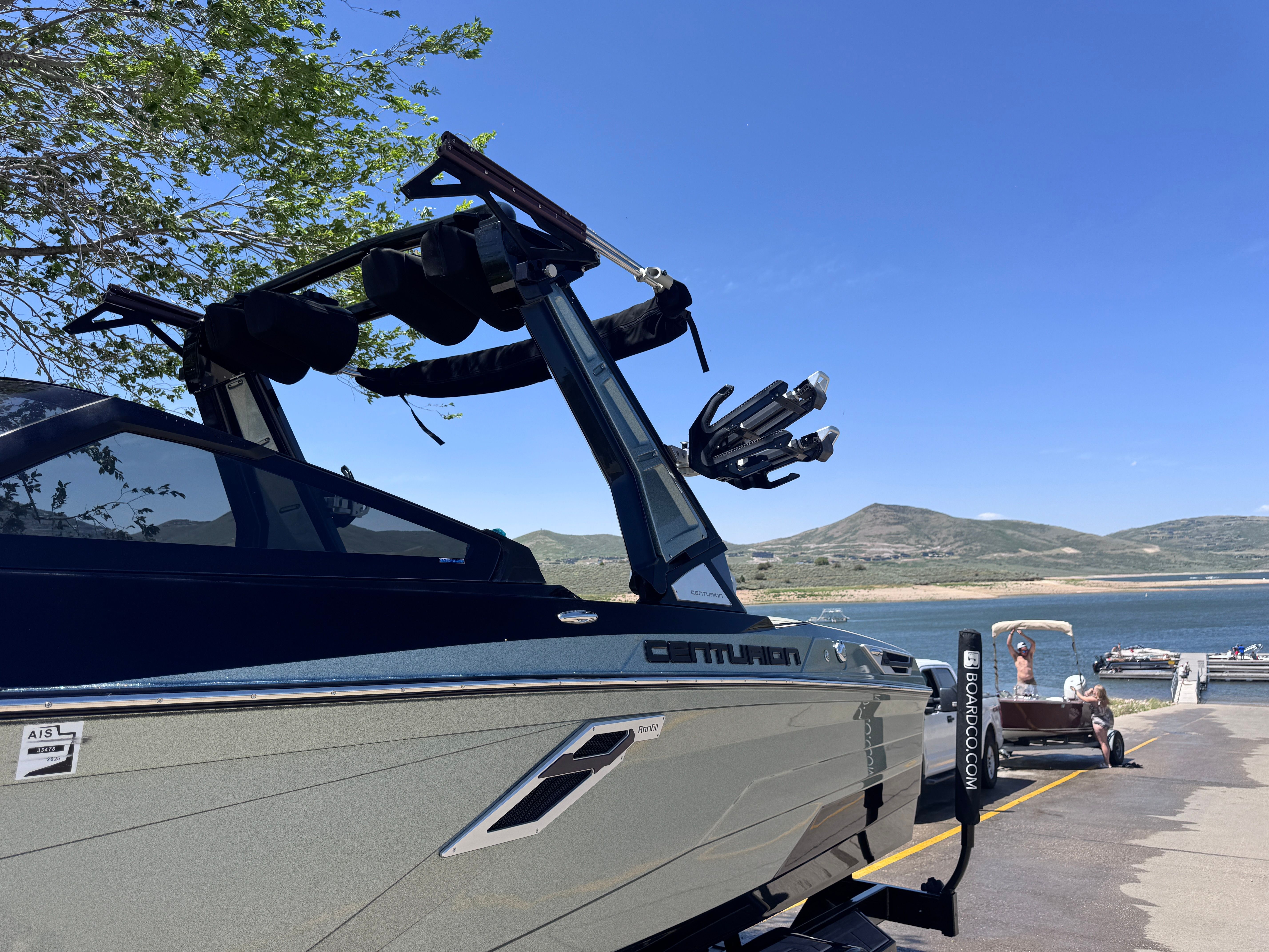 A 2022 Centurion Ri230 on a trailer by a lakeside.