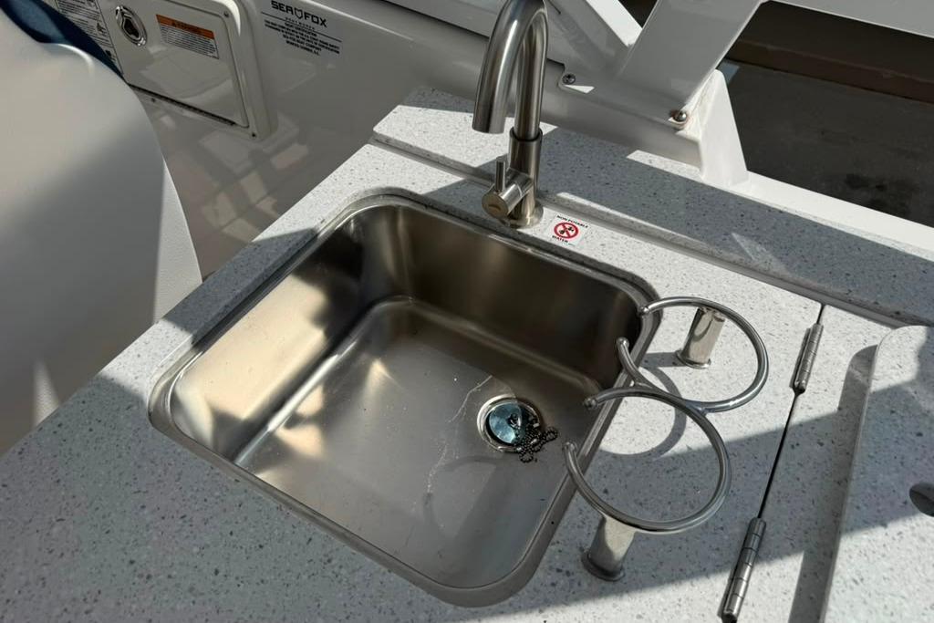 Stainless steel sink on 2026 Sea Fox 288 Traveler boat with modern faucet.