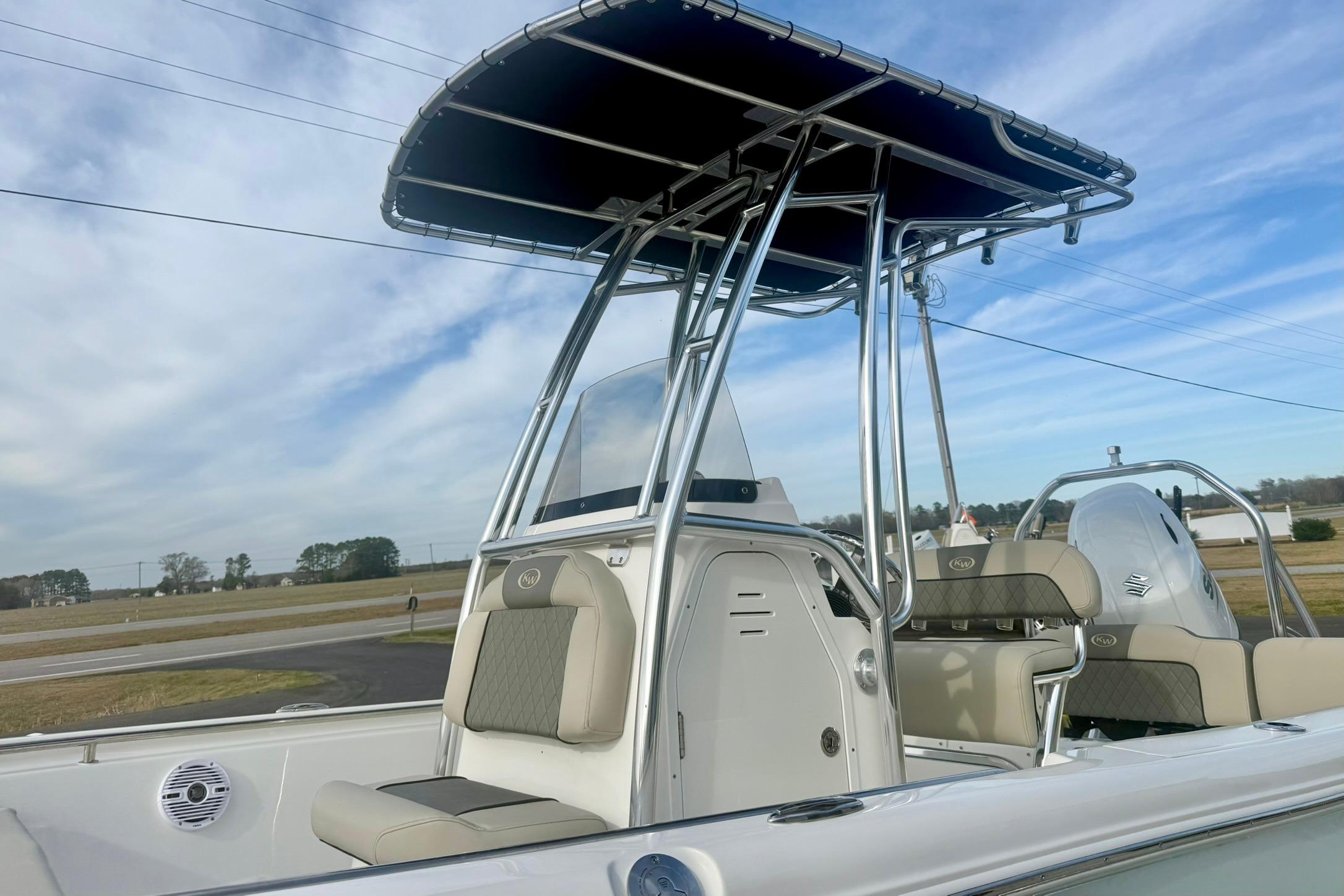 2026 Key West 189 FS boat with T-top and seating, under a clear sky.