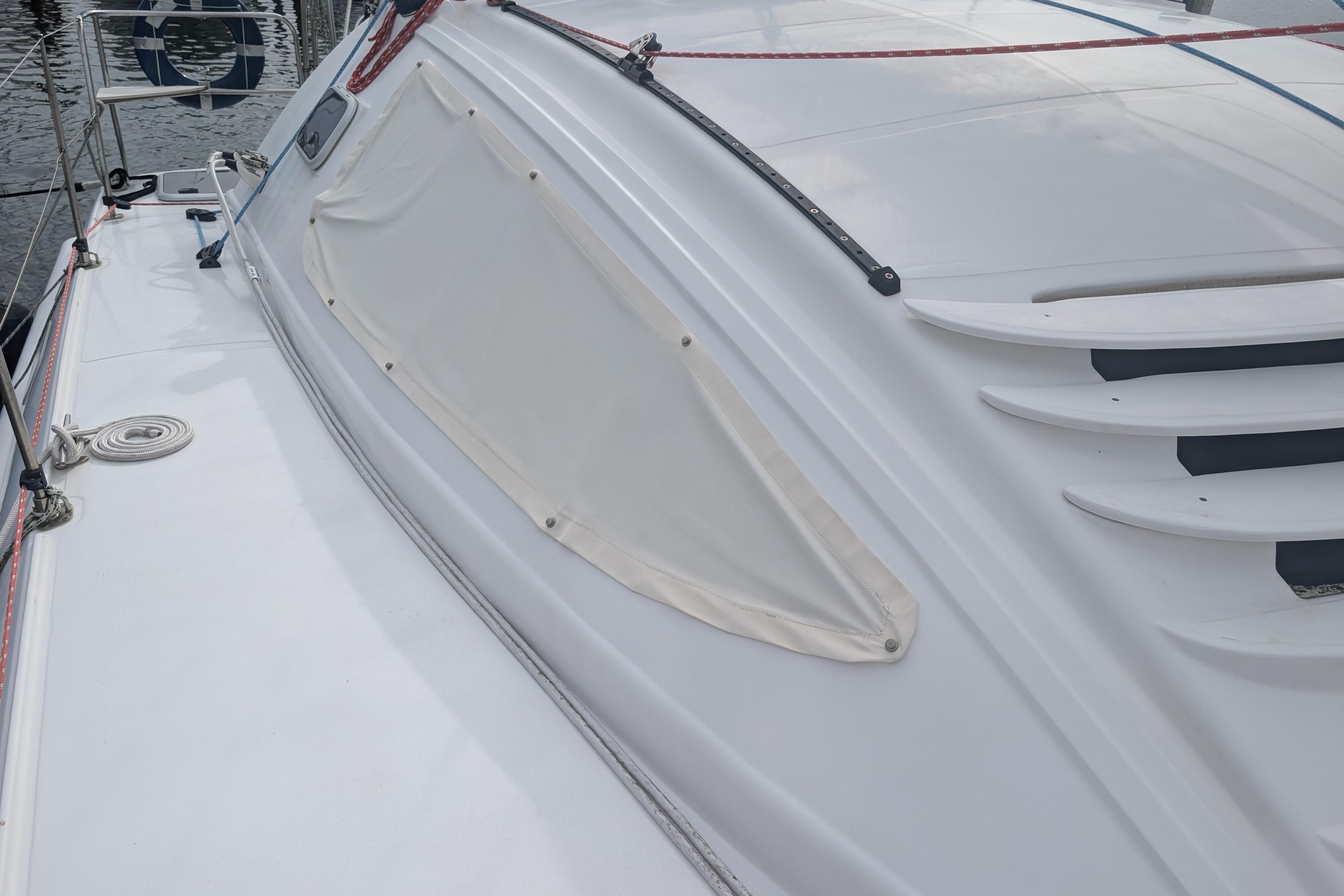 Sailboat deck of 1999 Island Spirit 37, featuring sleek design and covered window.