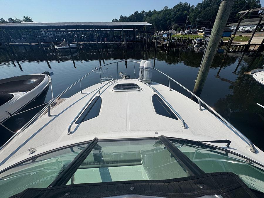 2015 Sea Ray 260 Sundancer docked at marina, view from bow.
