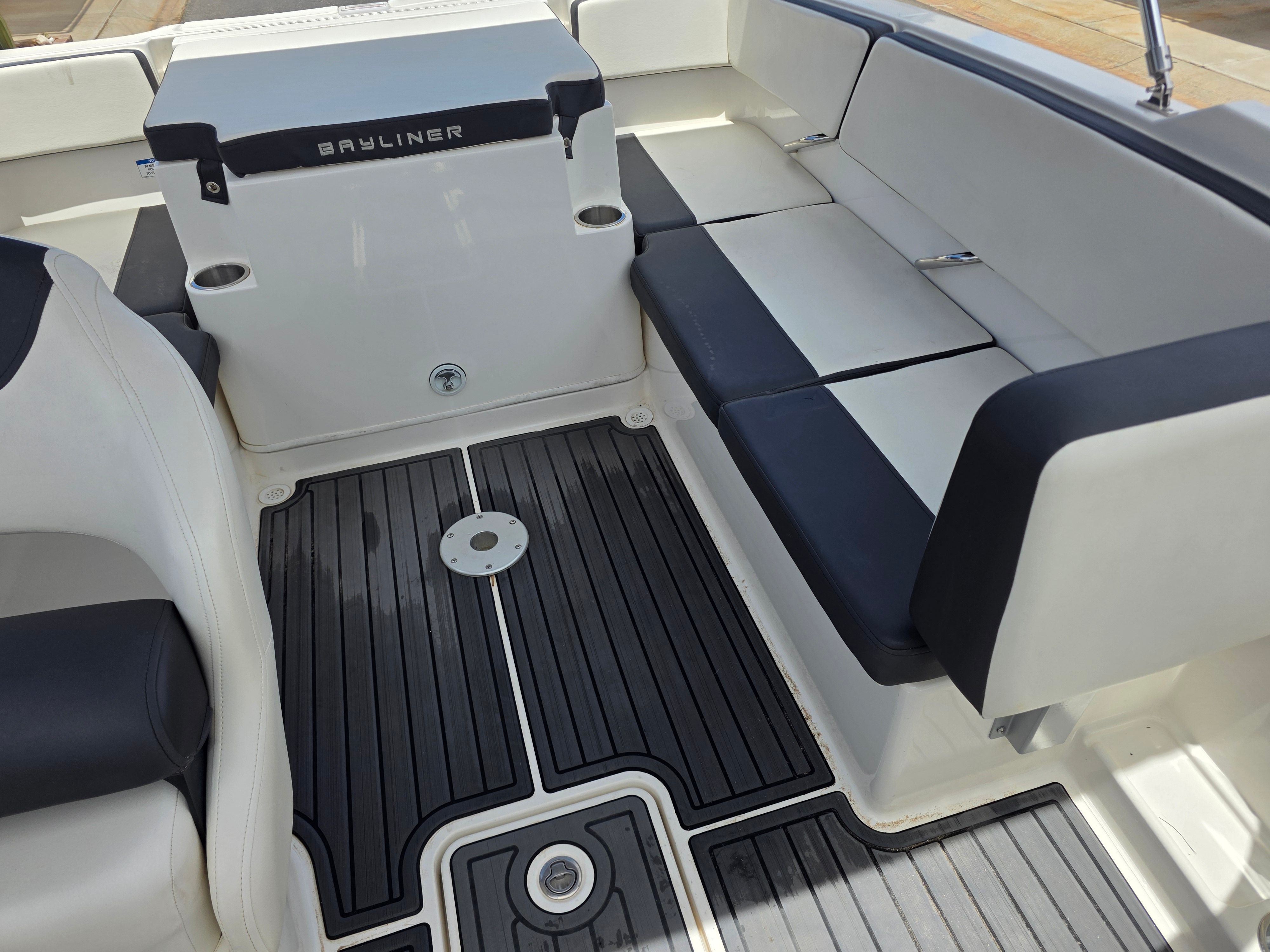 Interior of a Bayliner VR4 Bowrider I/O with black and white seating.