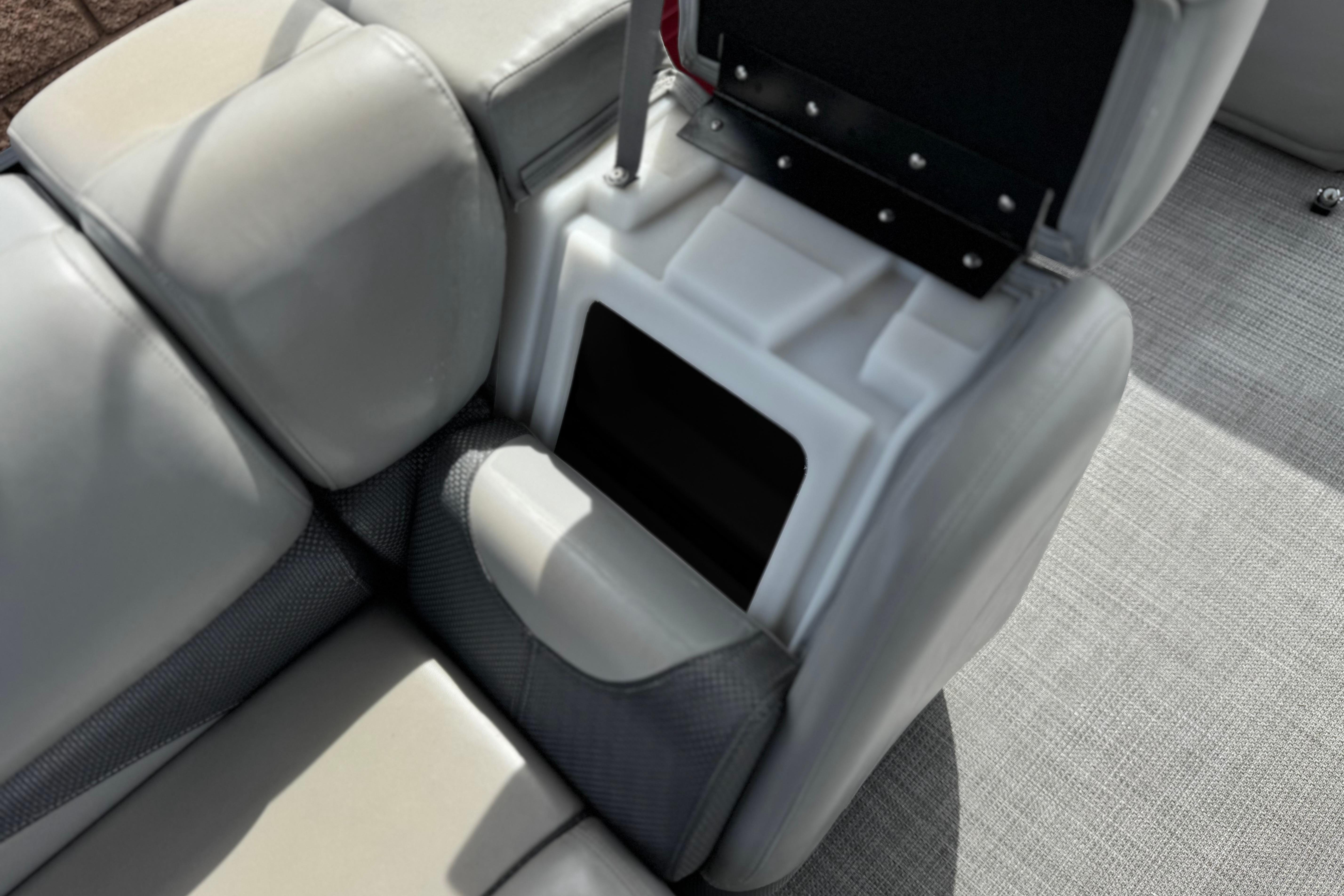 2022 Regency 250 DL3 boat seat with storage compartment, featuring sleek gray upholstery.