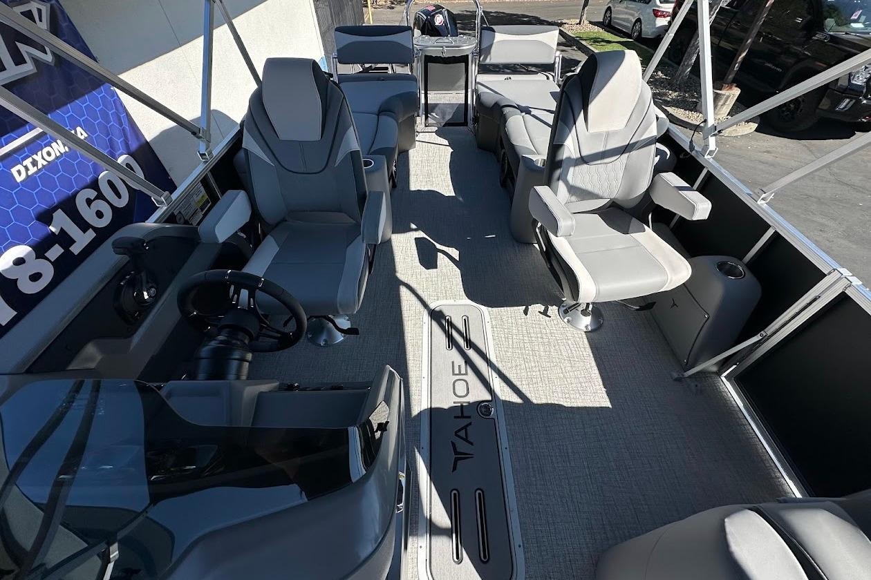 2026 Tahoe Pontoon LTZ Quad Lounger Shift 23 interior with modern seating and steering wheel.