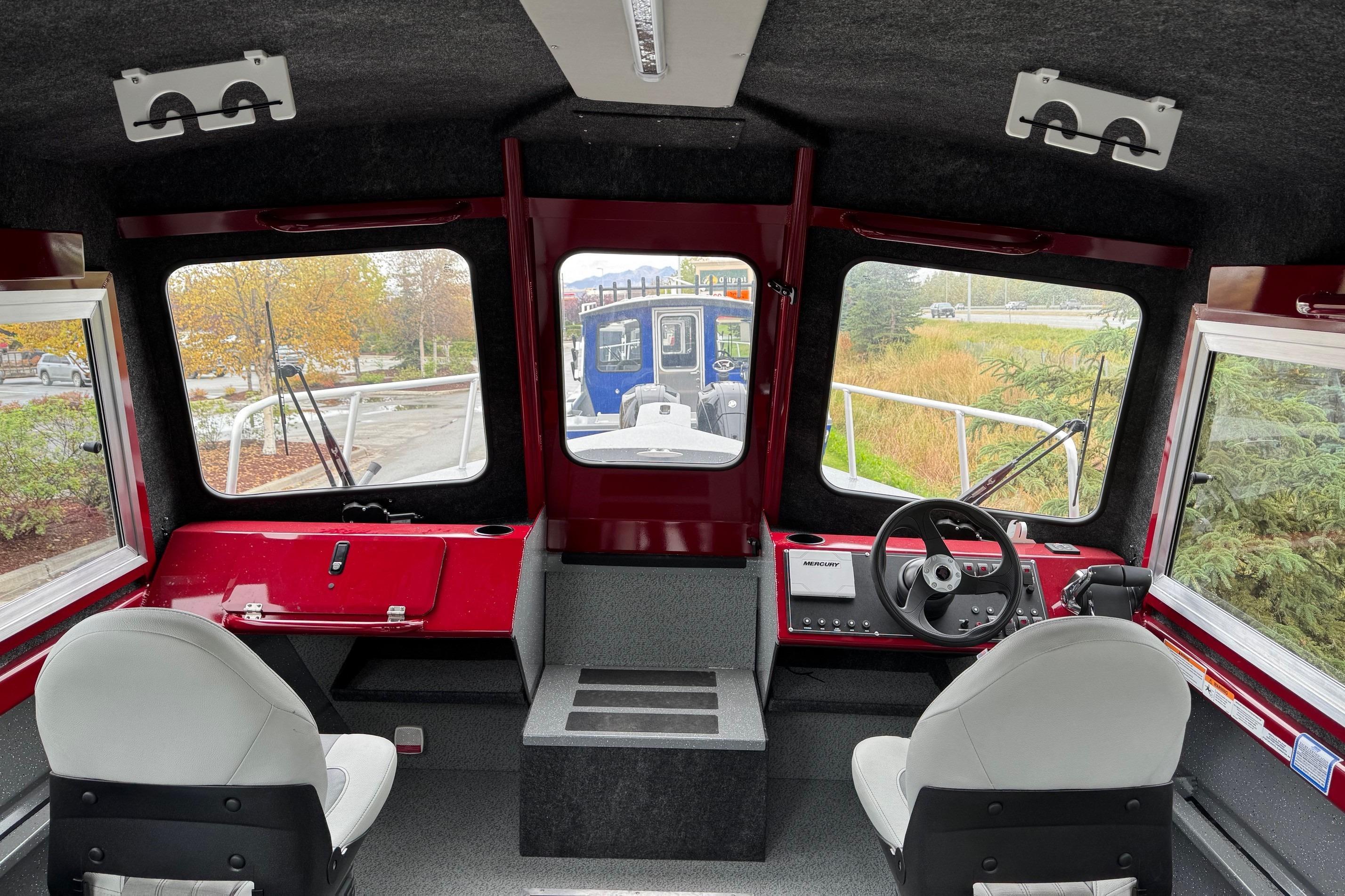 Interior of 2024 Spartan 24 MAXIMUS PRO XL boat with modern controls and seating.