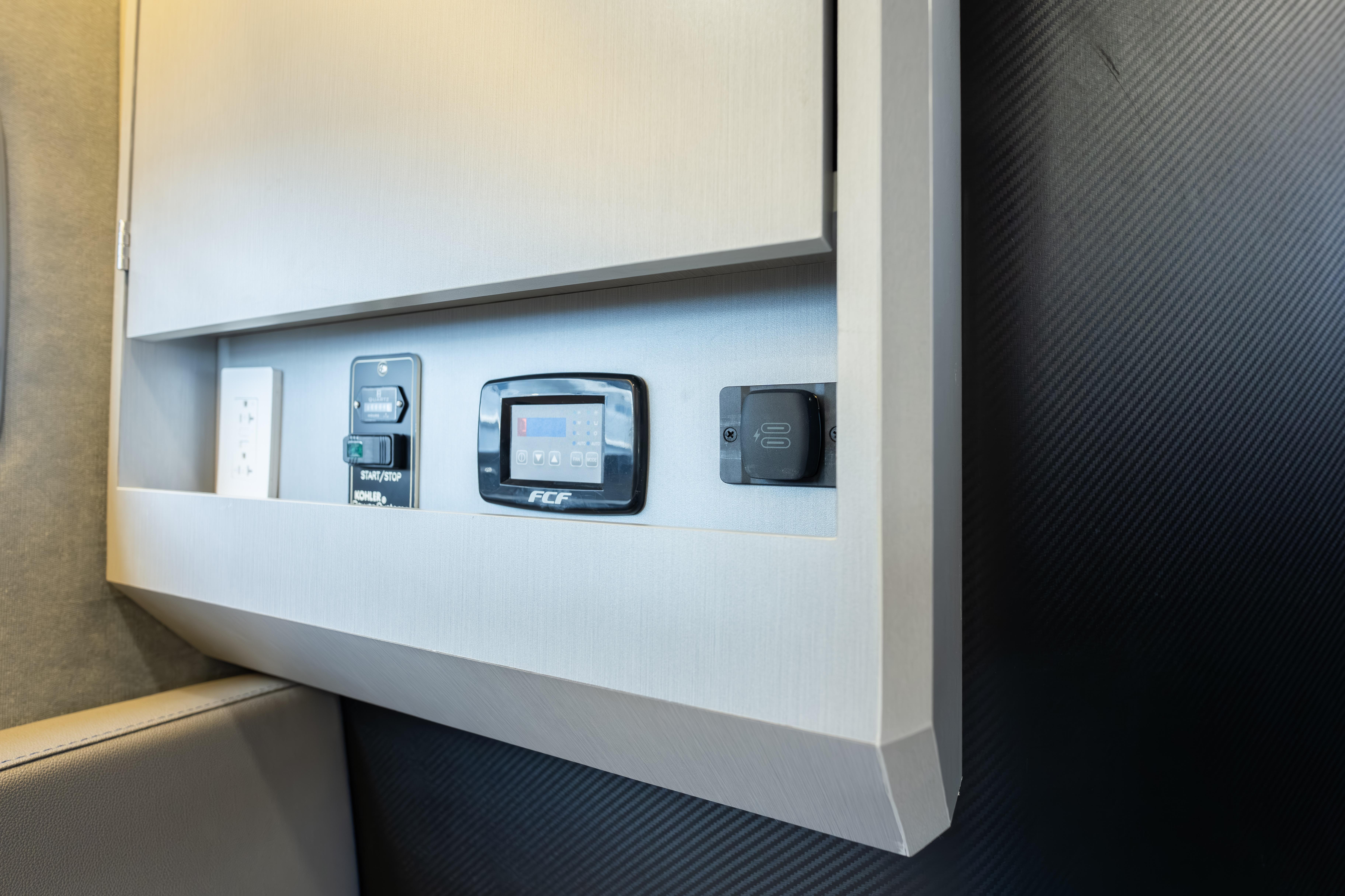 Control panel in Hanover 347, 2026 model, featuring modern switches and digital display.