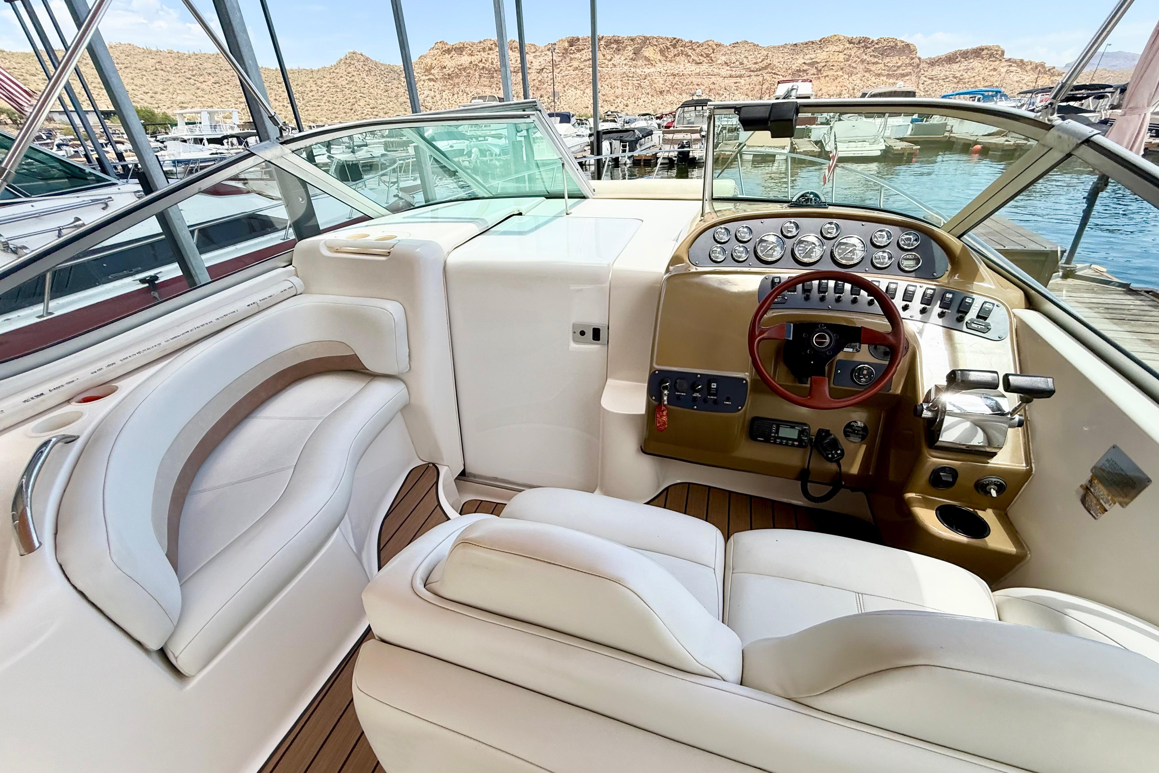 1999 Chaparral Signature 300 boat interior with luxurious seating and modern dashboard controls.