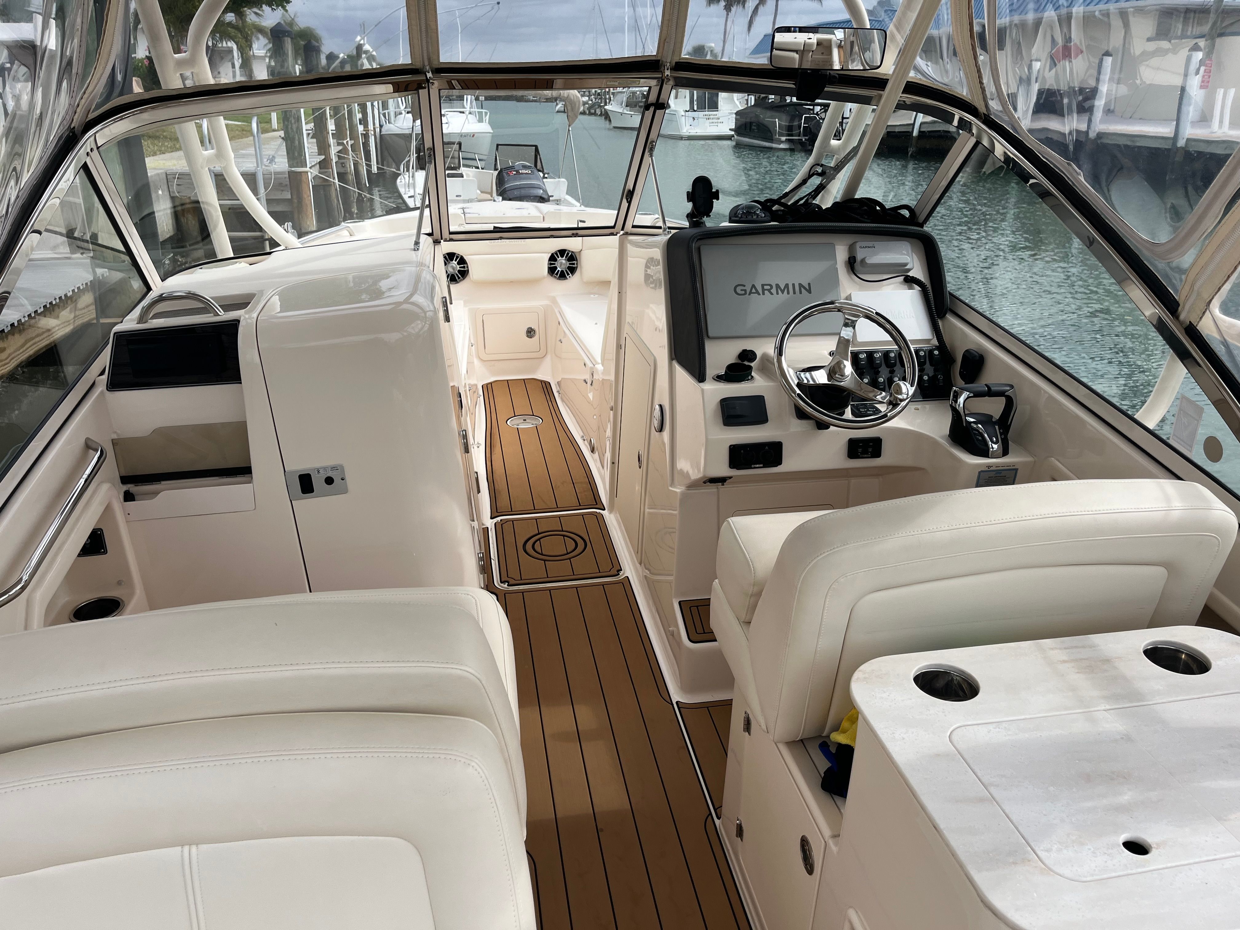 Interior of a 2022 Grady-White Freedom 275 boat with Garmin controls.