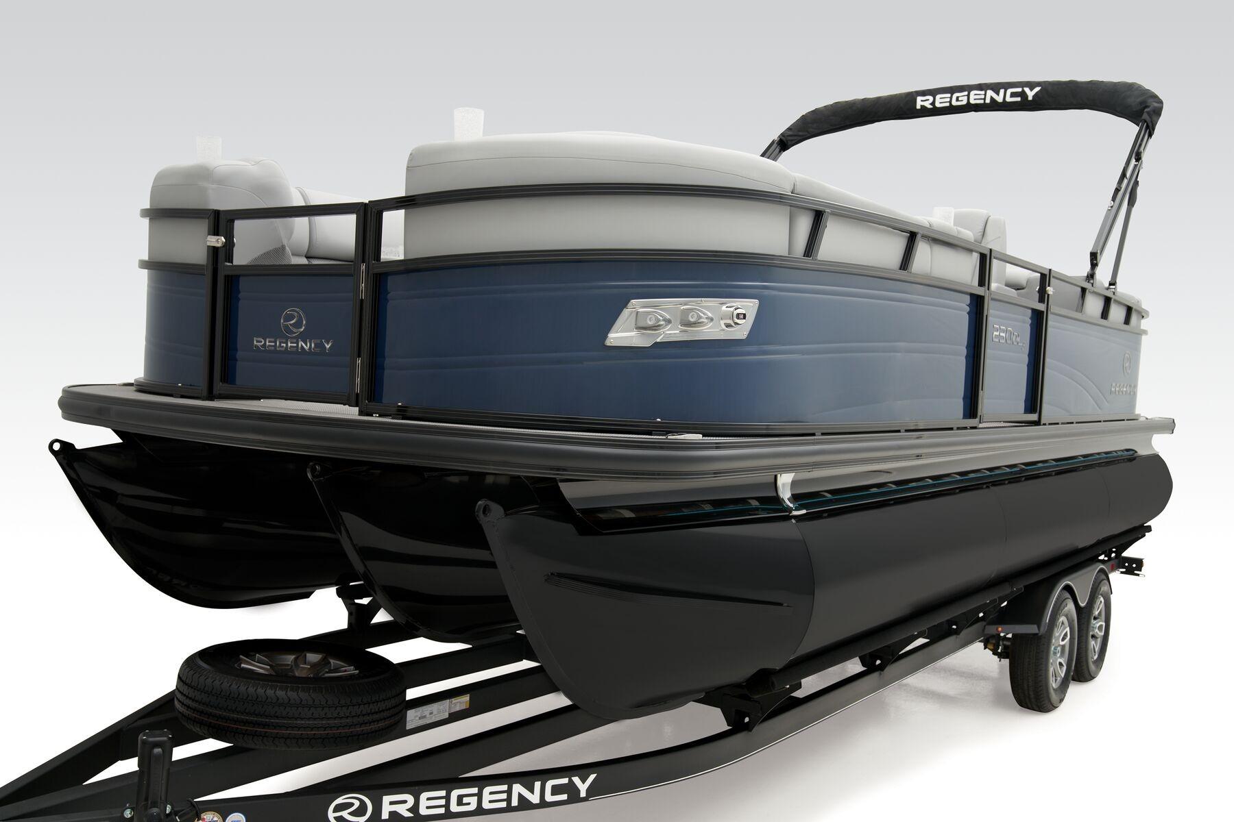 2026 Regency 230 DL pontoon boat on trailer, featuring sleek design and modern amenities.