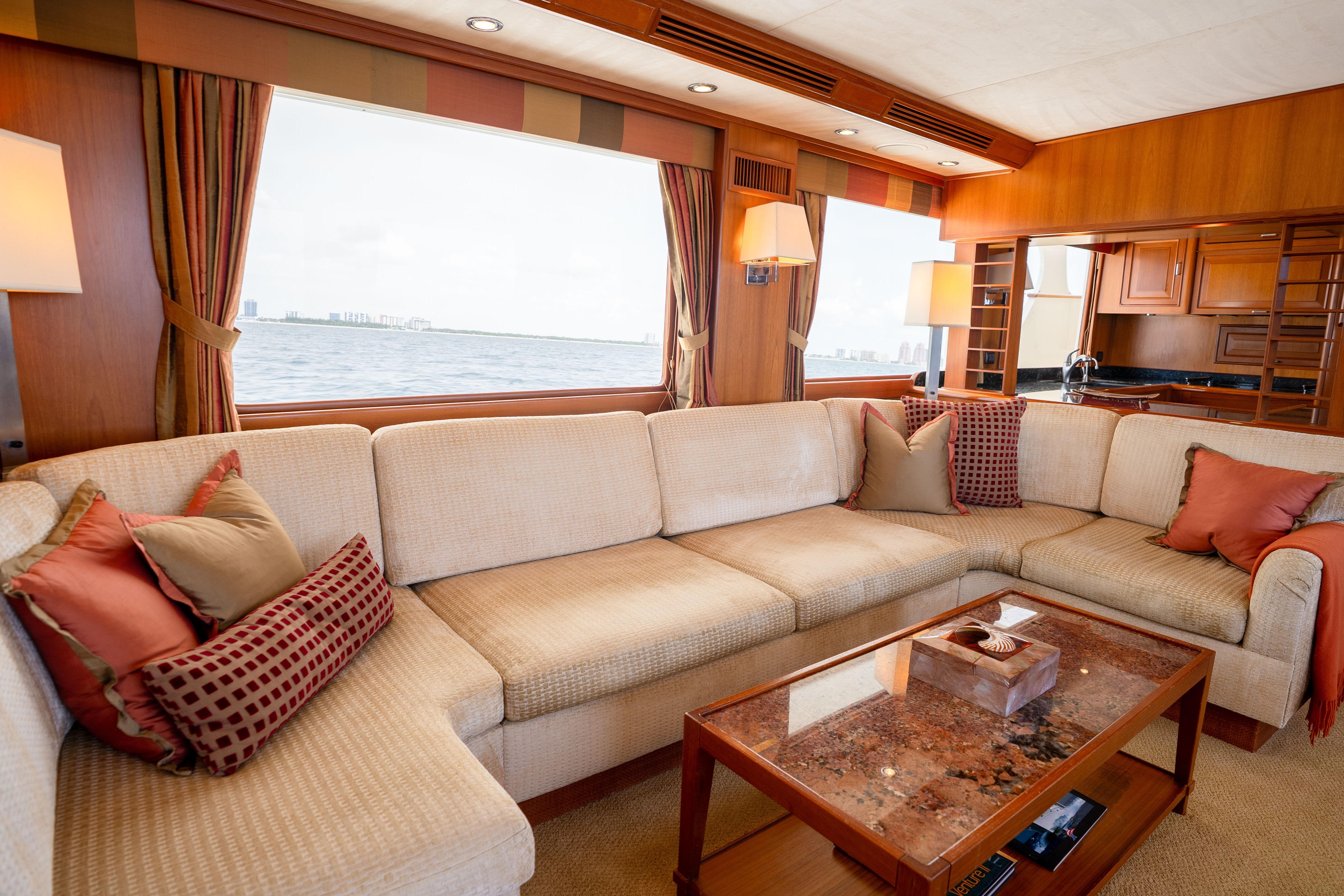 Luxurious 2006 Fleming 75 yacht interior with elegant seating and ocean view.