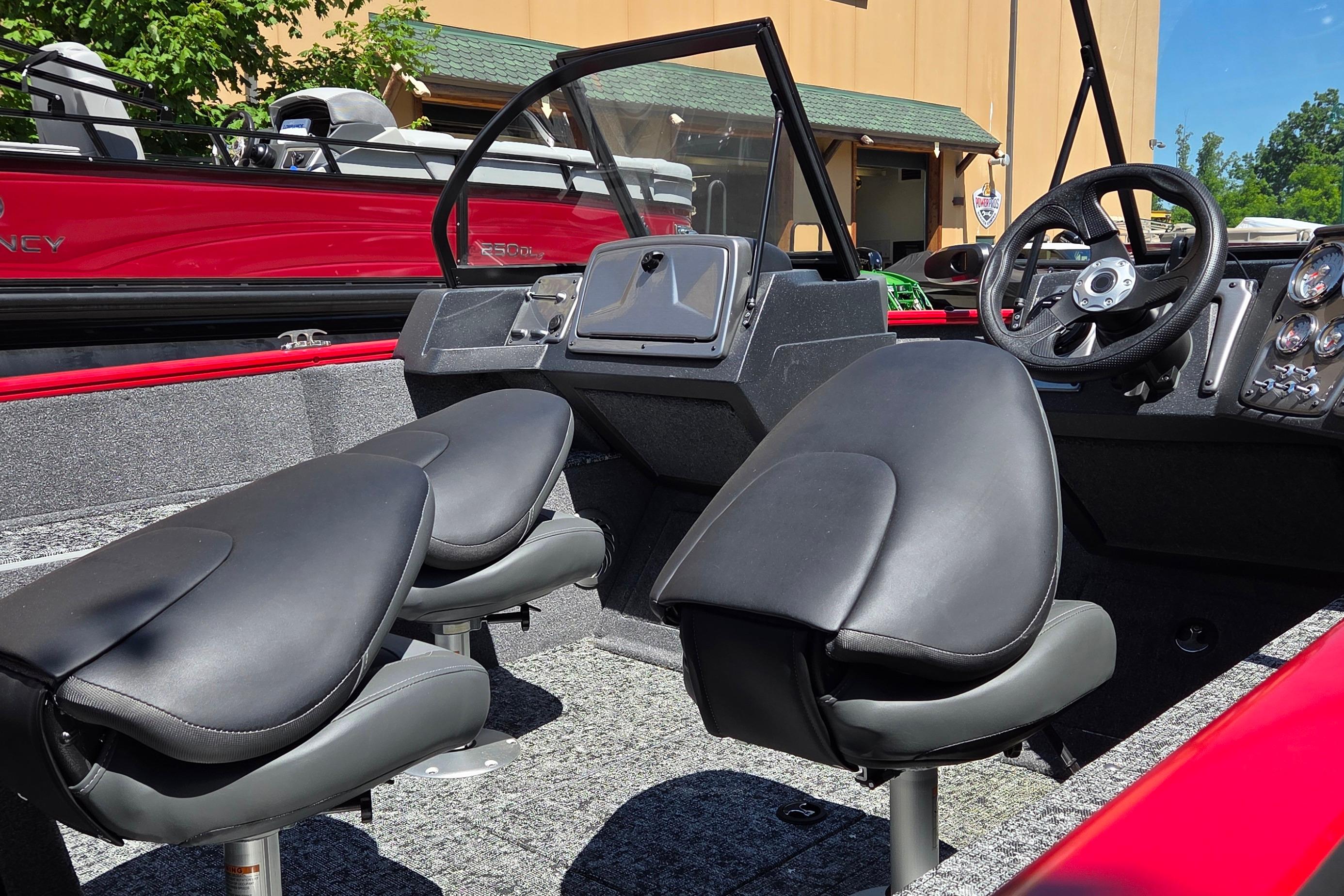 2026 Tracker Pro Guide V-175 Combo boat interior with black seats and steering console.