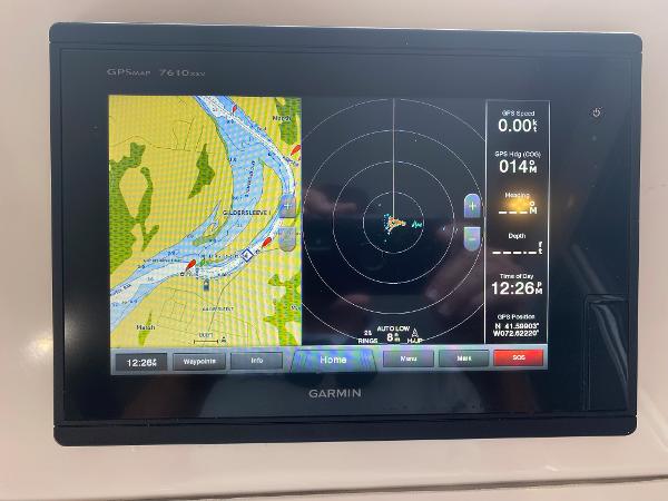 Garmin GPS chartplotter displaying river map and navigation data.