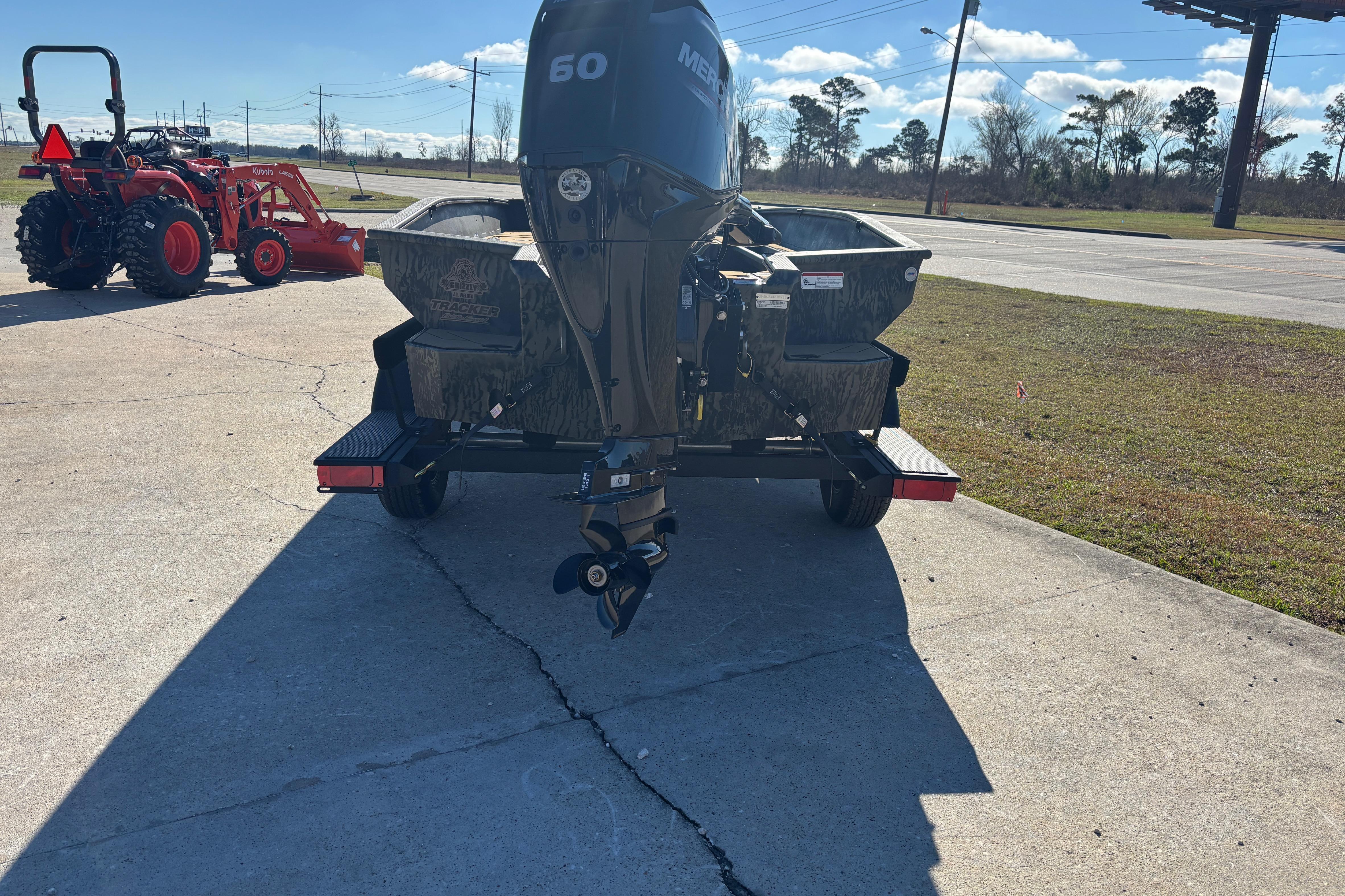 2026 Tracker Grizzly 1756 T Marsh boat with Mercury 60 engine on trailer.