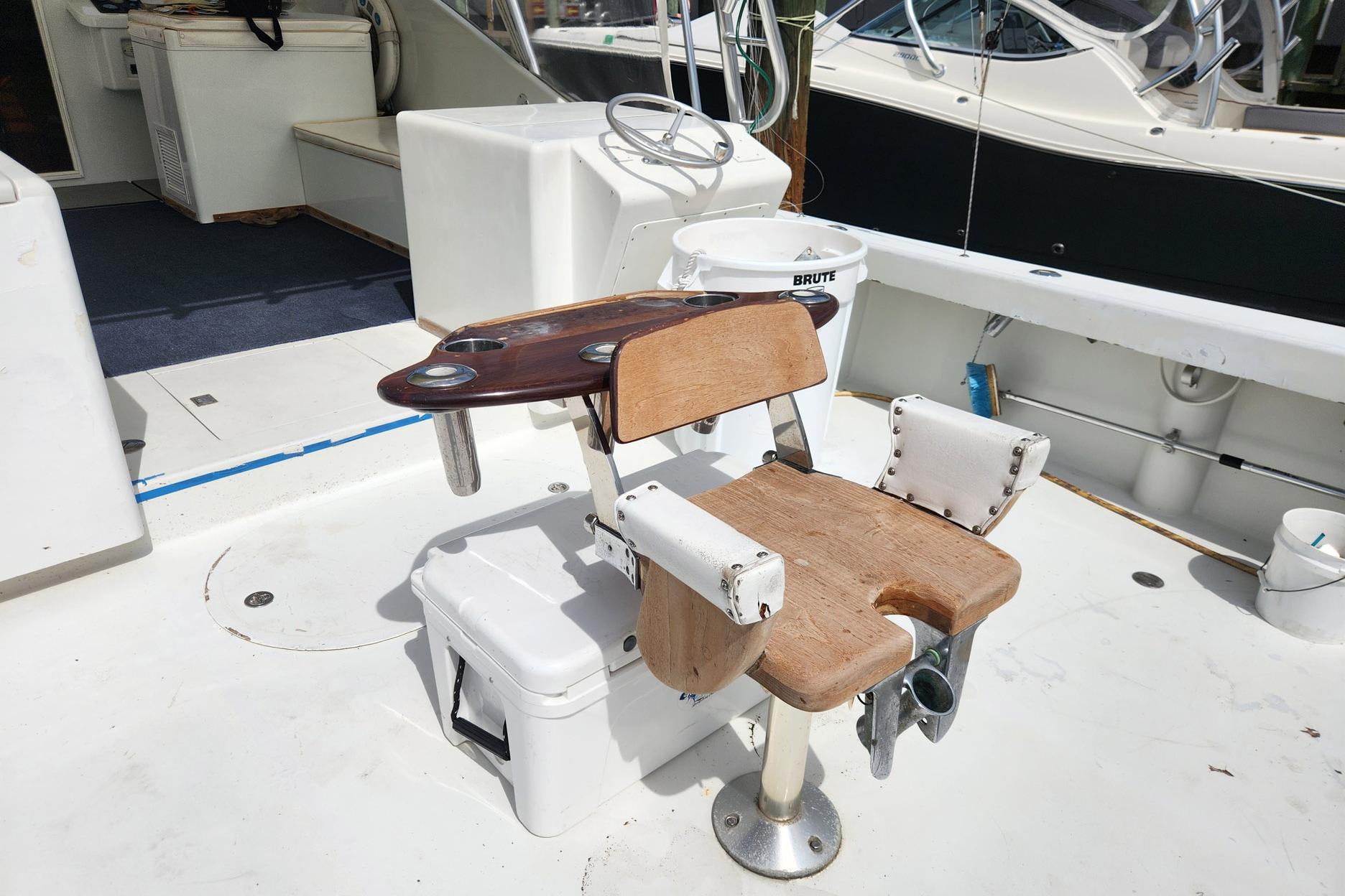 Fishing chair on 1987 Young Brothers Custom Sport Fish boat deck.