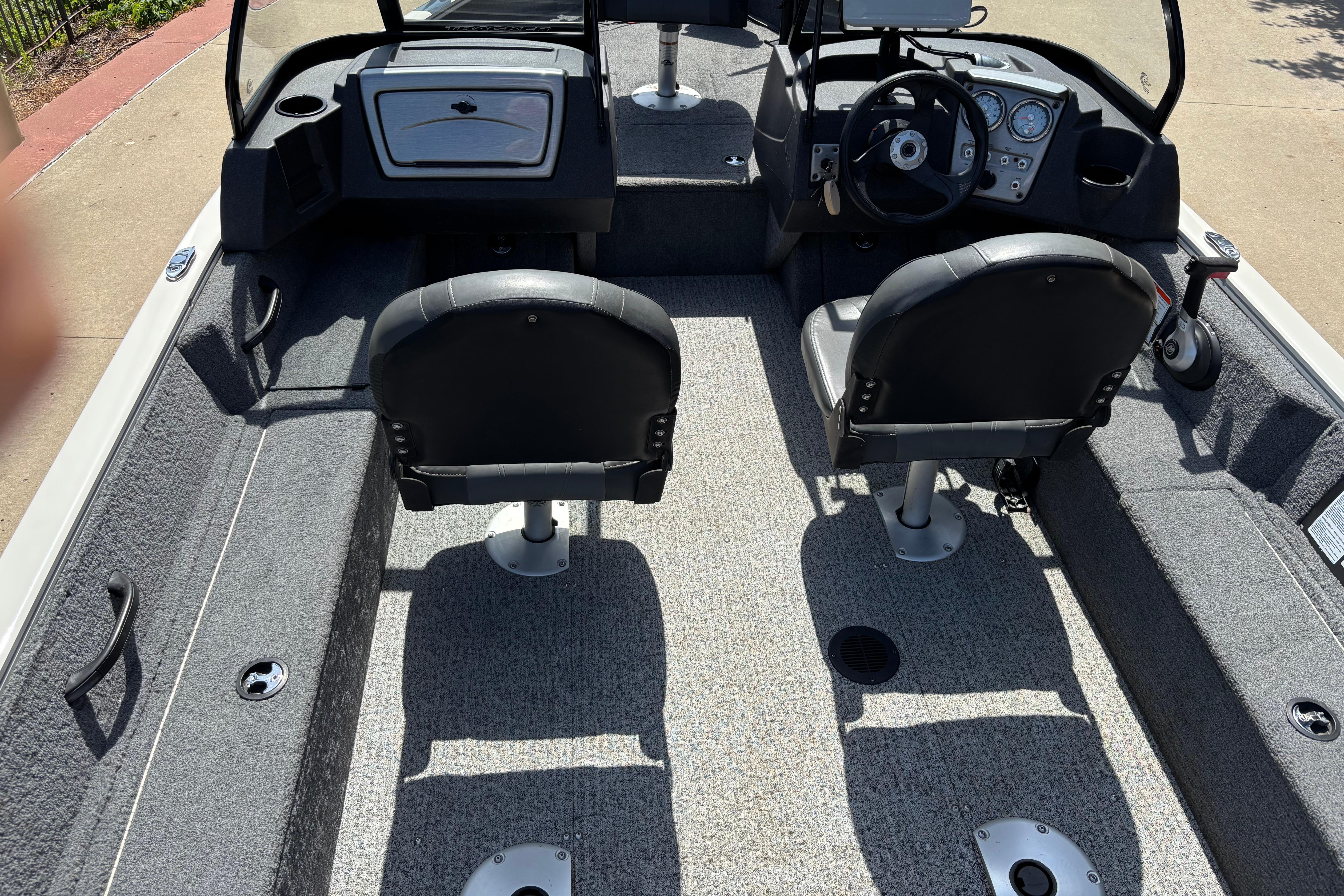 2022 Tracker Pro Guide V-16 SC boat interior with dual seats and steering console.