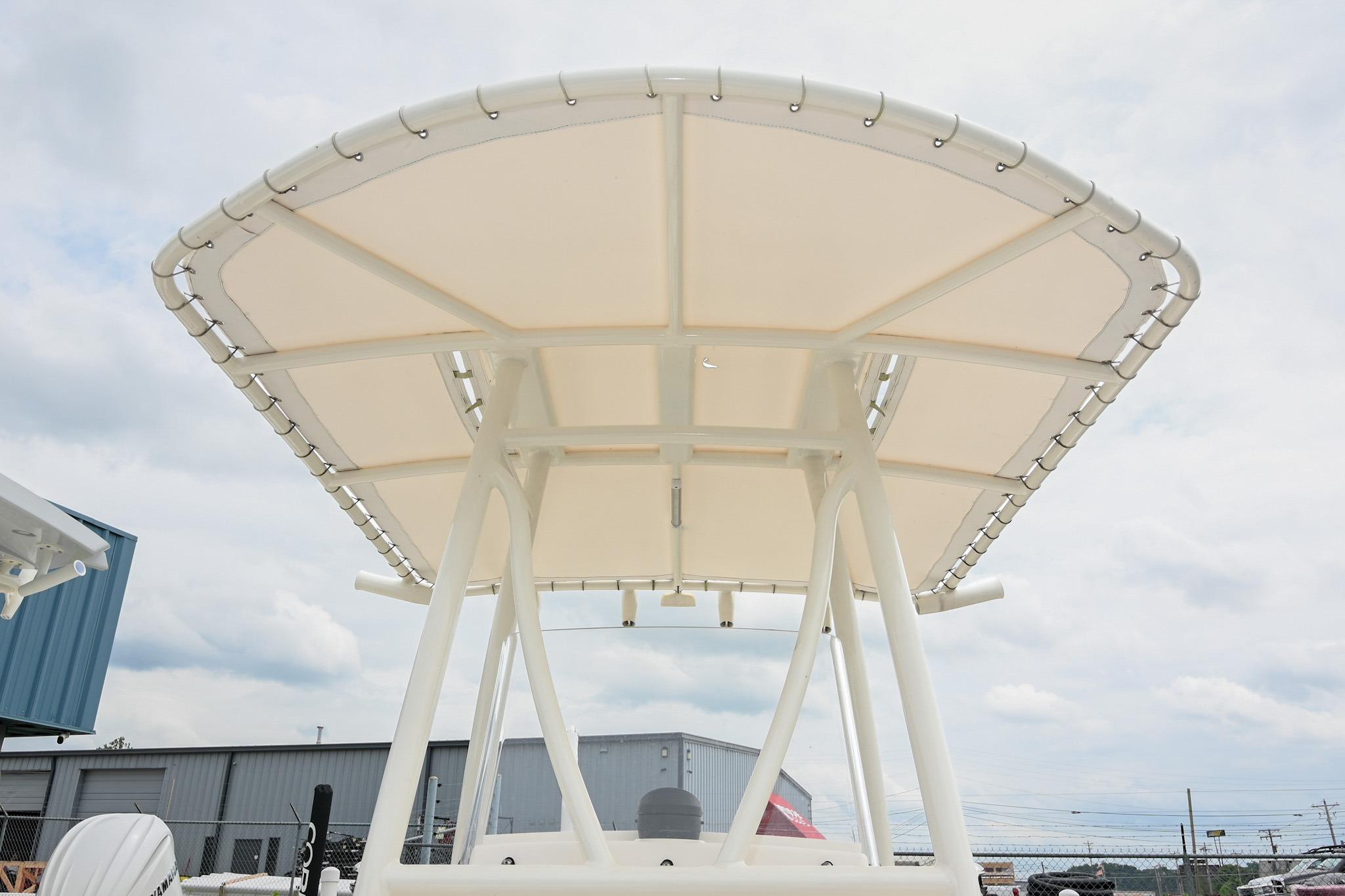 2021 Pathfinder 2200 TRS boat T-top canopy against cloudy sky.