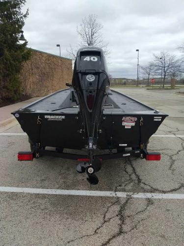 2025 Tracker Panfish 17 boat with 40 HP motor in parking lot.