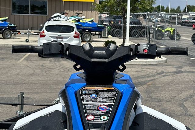 Handlebars of a Yamaha WaveRunner JETBLASTER in black, parked in a lot.