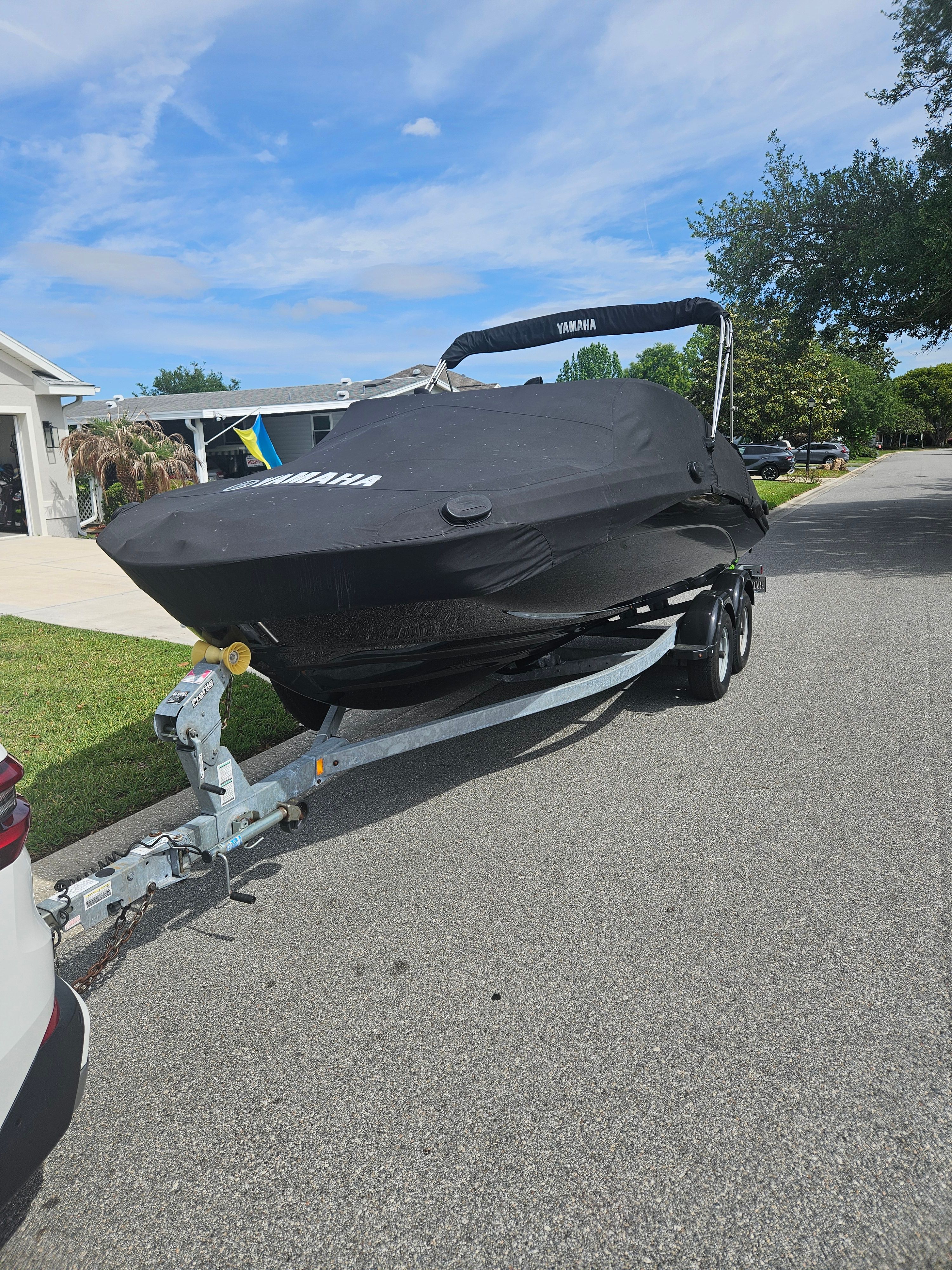 2022 Yamaha SX210 boat on trailer with cover.