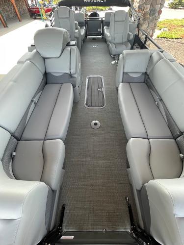 2024 Regency 230 DL3 pontoon boat interior with spacious gray seating and modern design.