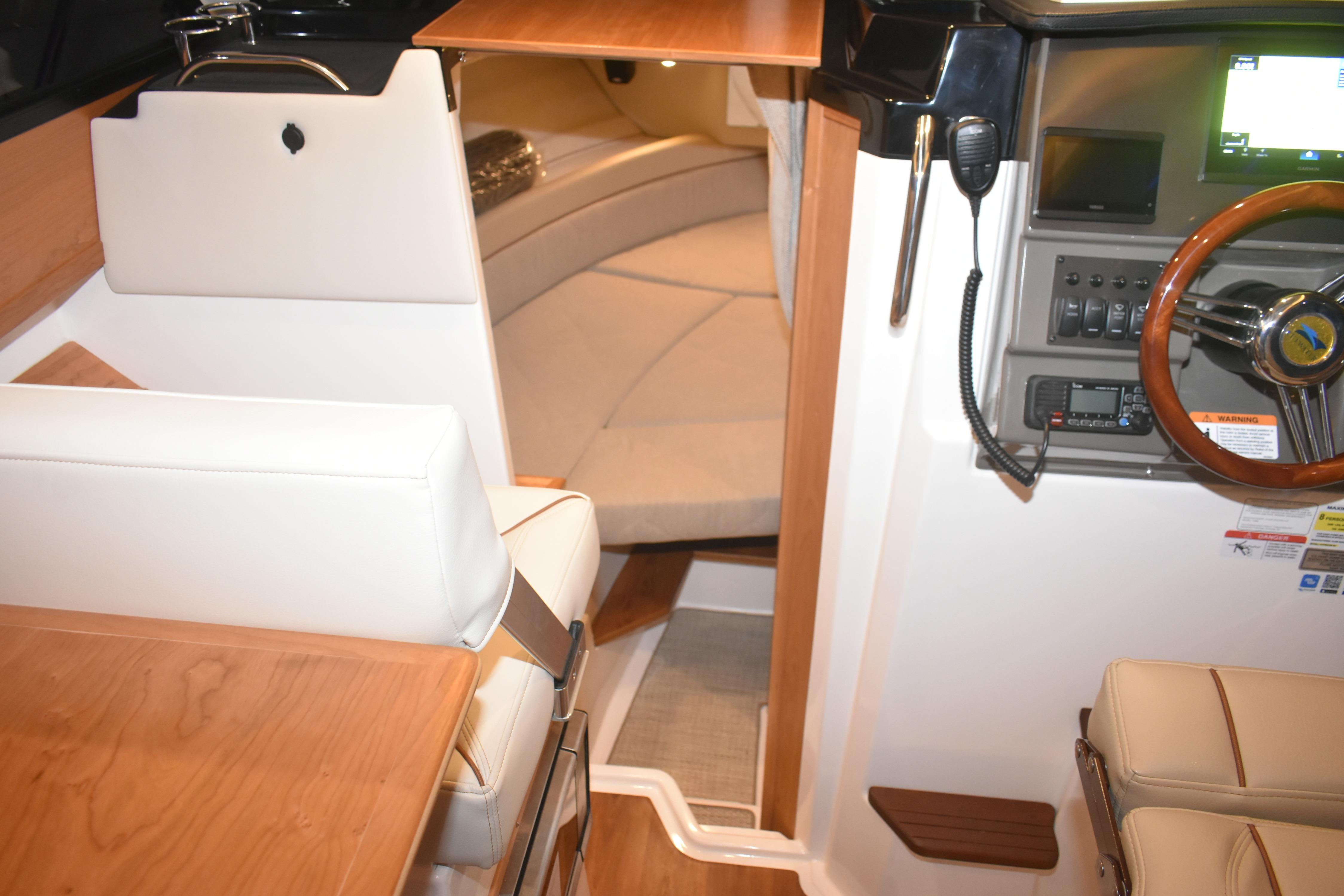 2026 Cutwater C-248 Coupe interior with helm, seating, and cabin view.