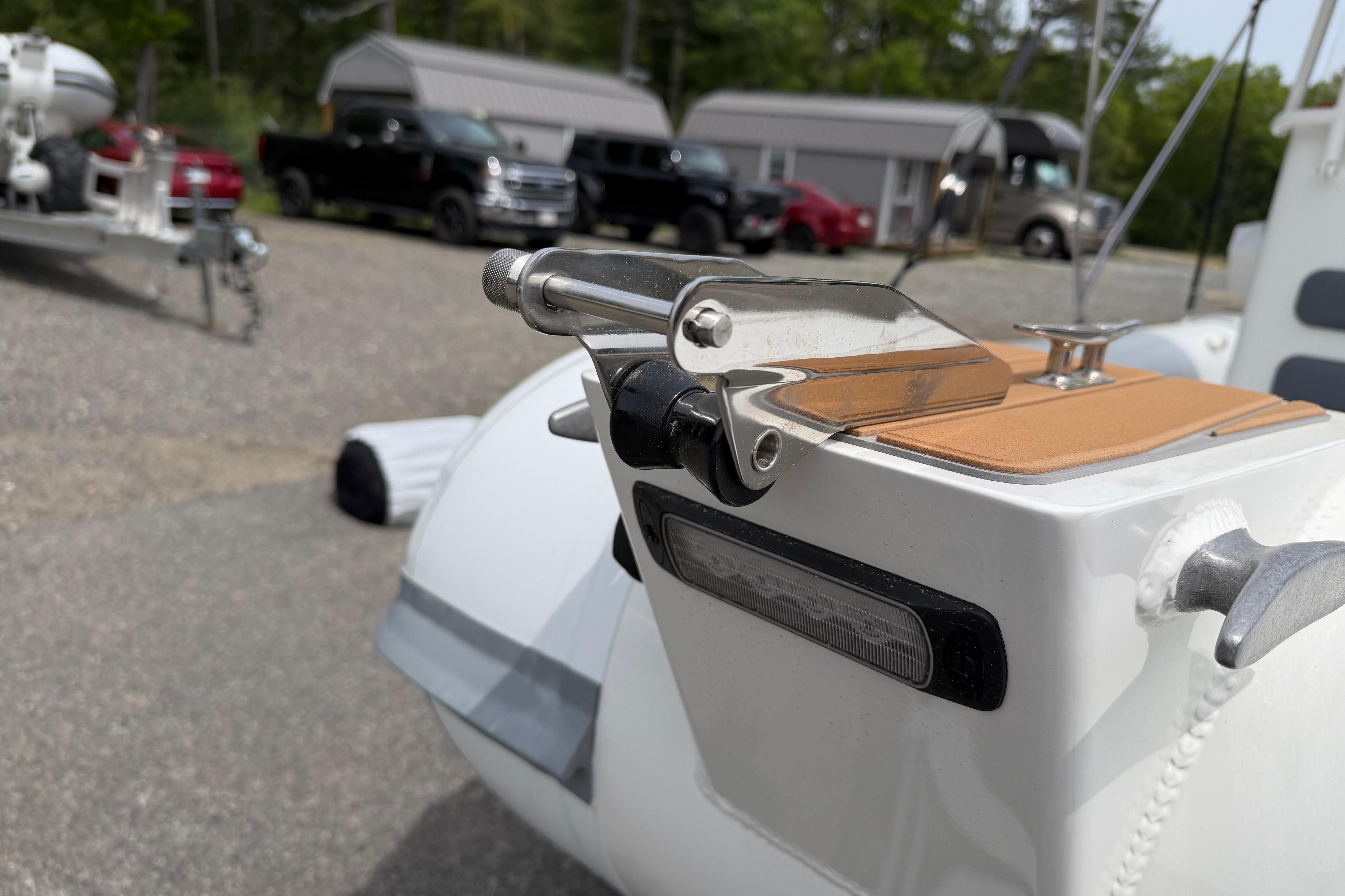 2024 Sealegs 7.1m RIB boat detail with stainless steel fittings and trailer in background.