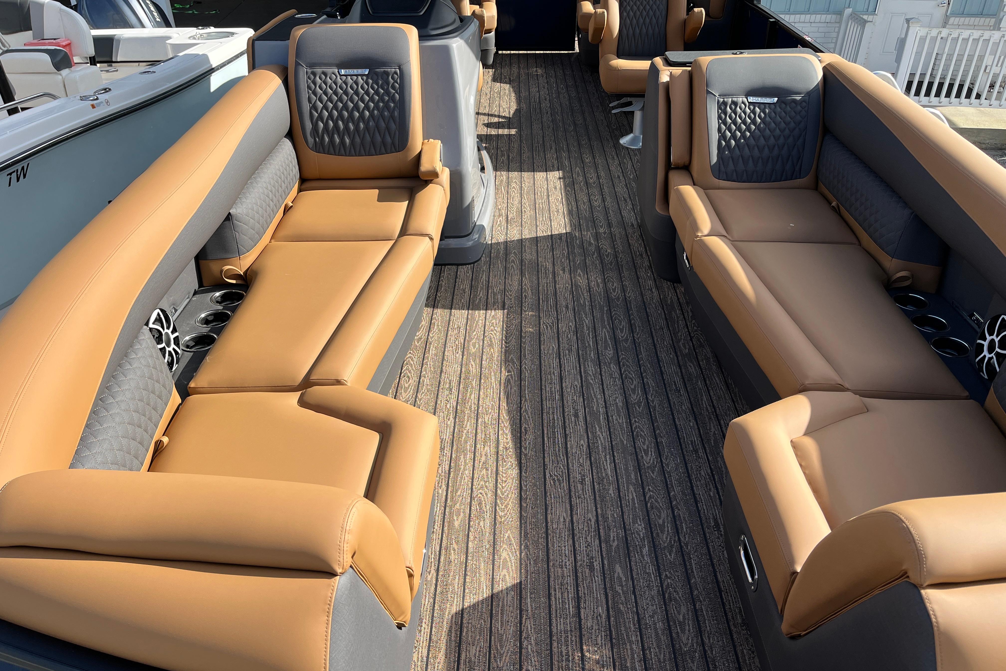 Interior of Harris Sunliner 250 pontoon boat, 2026 model, featuring luxurious leather seating.