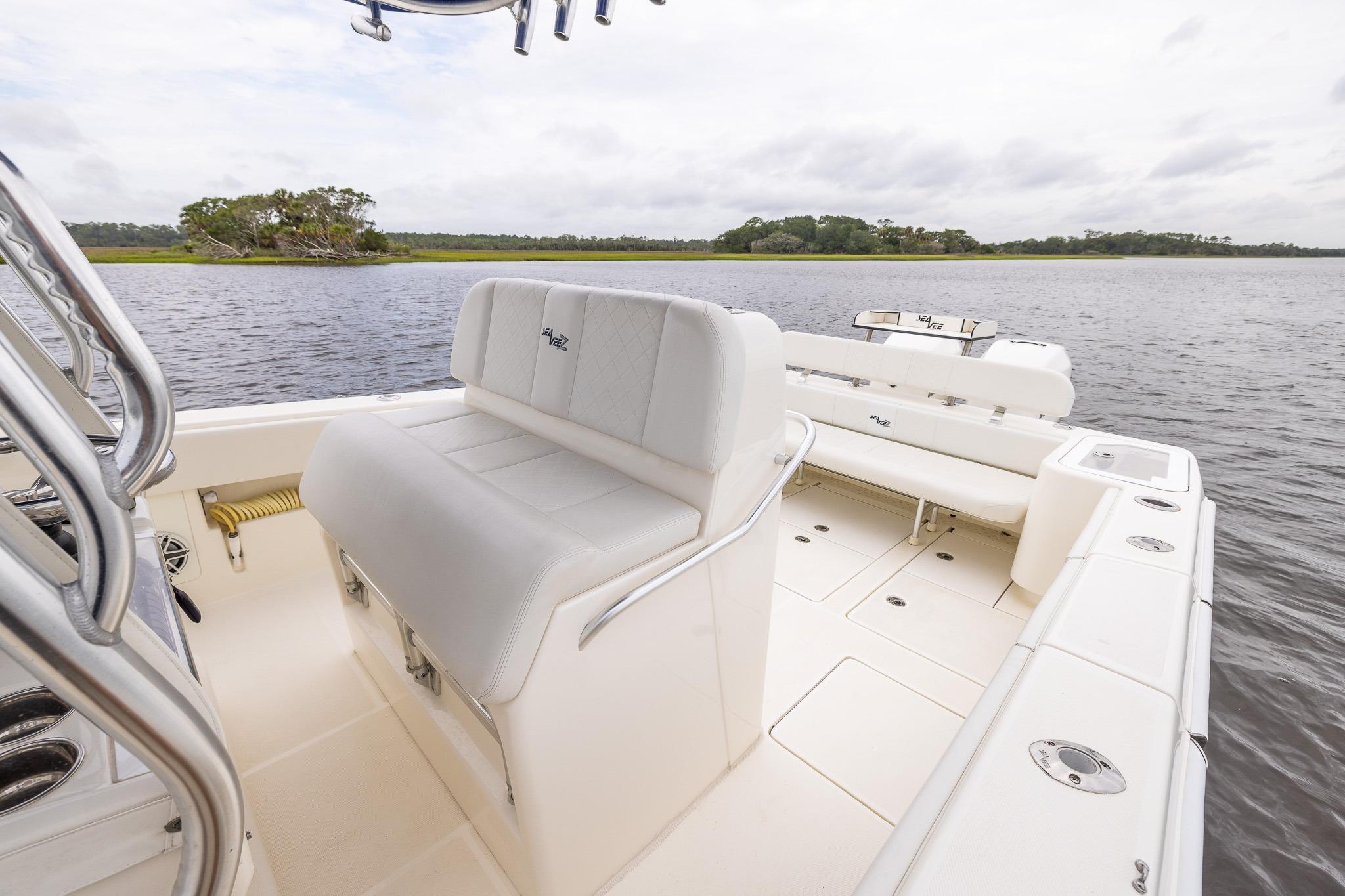 2019 SeaVee 322Z boat interior with white seating, on calm water.