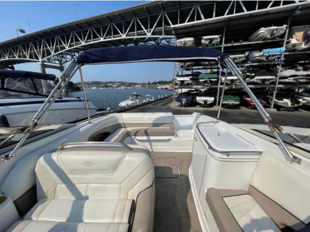 1999 Cobalt 293 boat docked under bridge.