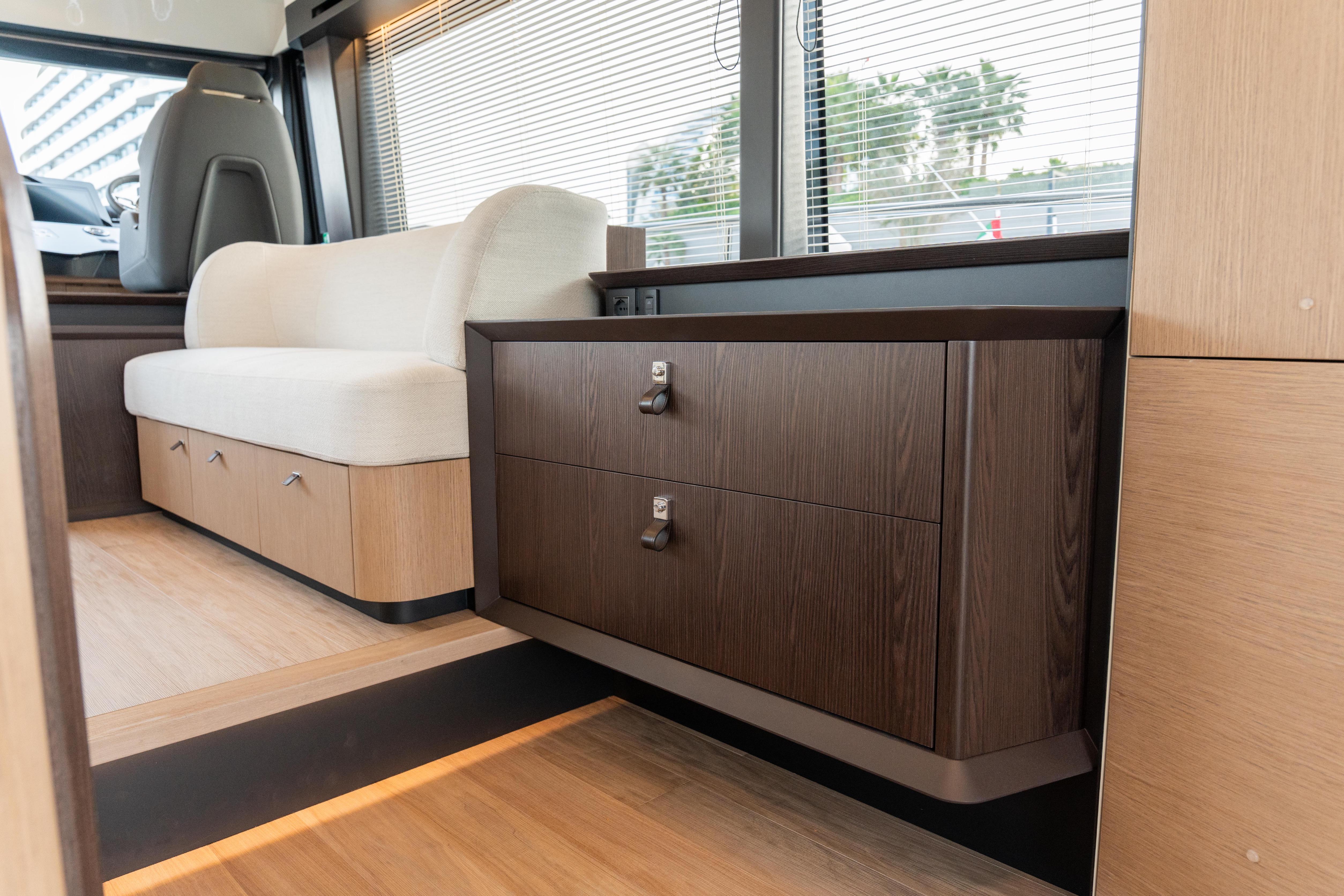 Luxurious interior of 2025 Absolute 52 FLY yacht with modern seating and cabinetry.