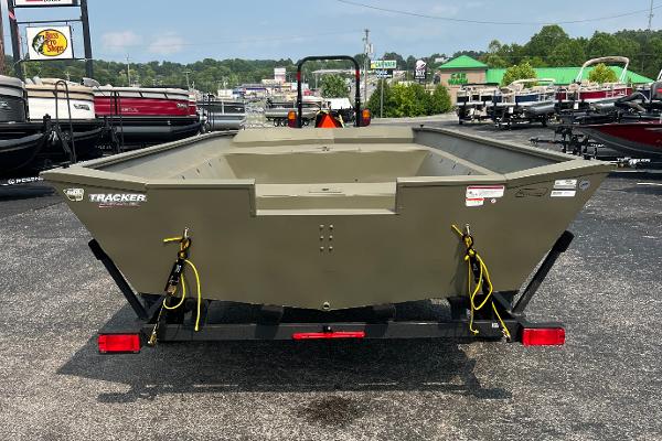 2025 Tracker GRIZZLY 2072 Utility boat on trailer, parked outdoors.