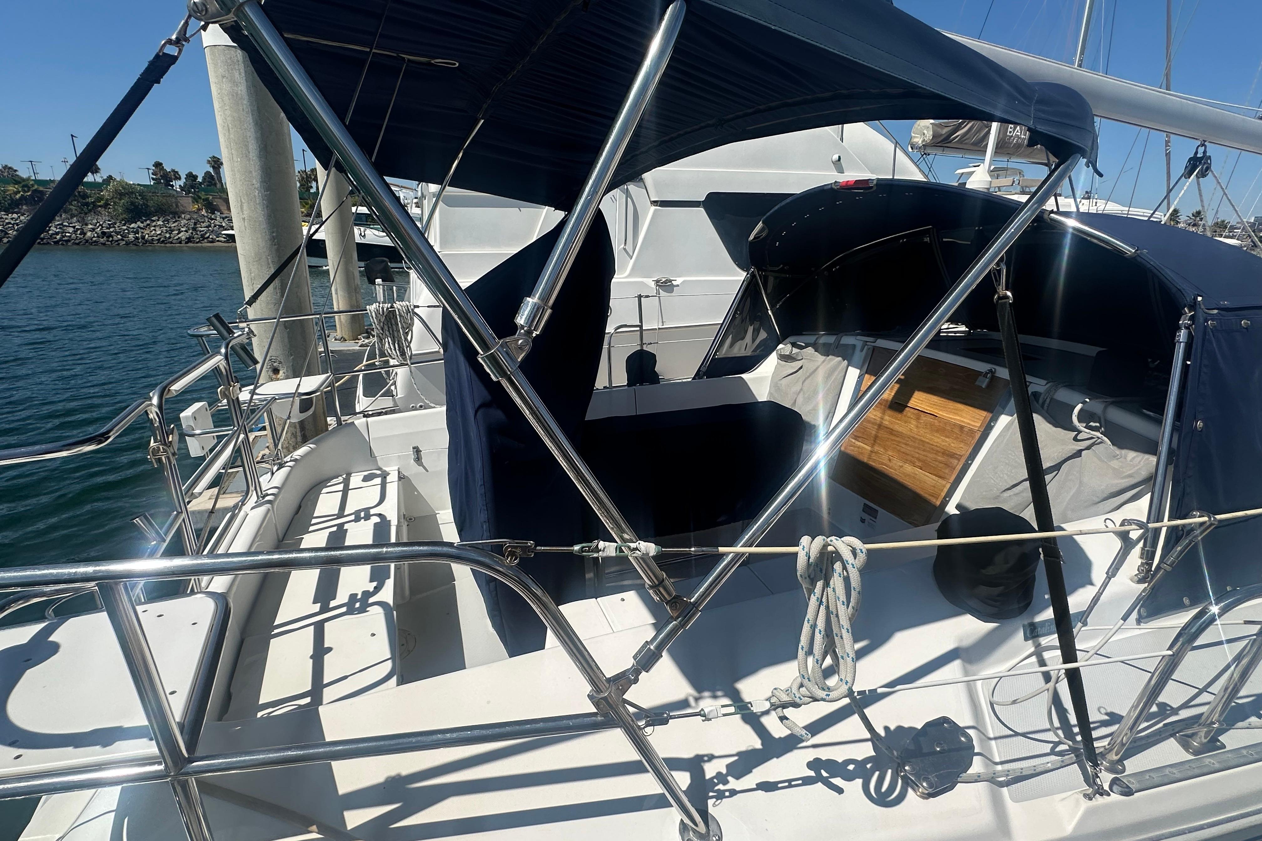 2005 Catalina 36 MkII sailboat cockpit with blue canopy and polished railings.