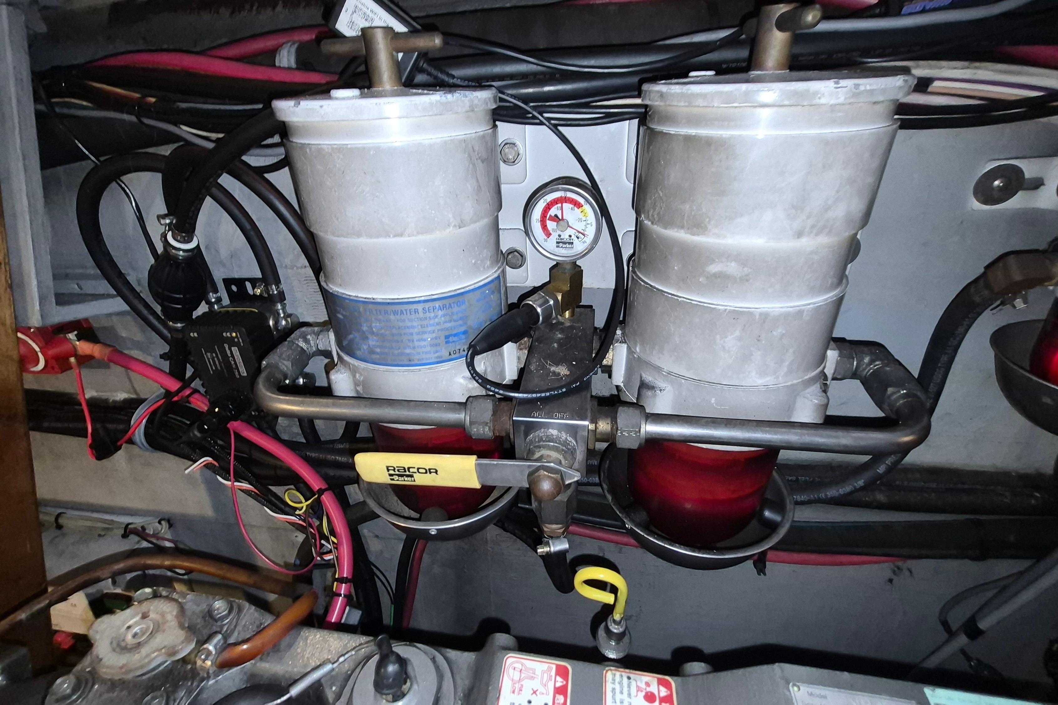 Engine compartment of 2009 Endeavour 40 Skylounge with fuel filter system and wiring.