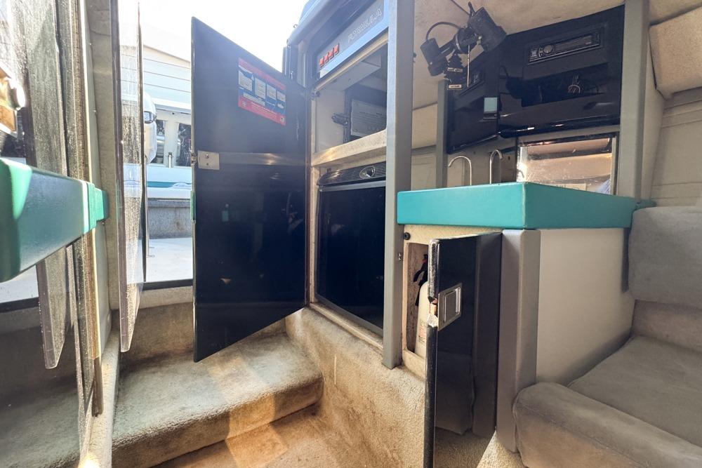 Interior of 1989 Formula 292 SR-1 boat with open cabinets and seating area.