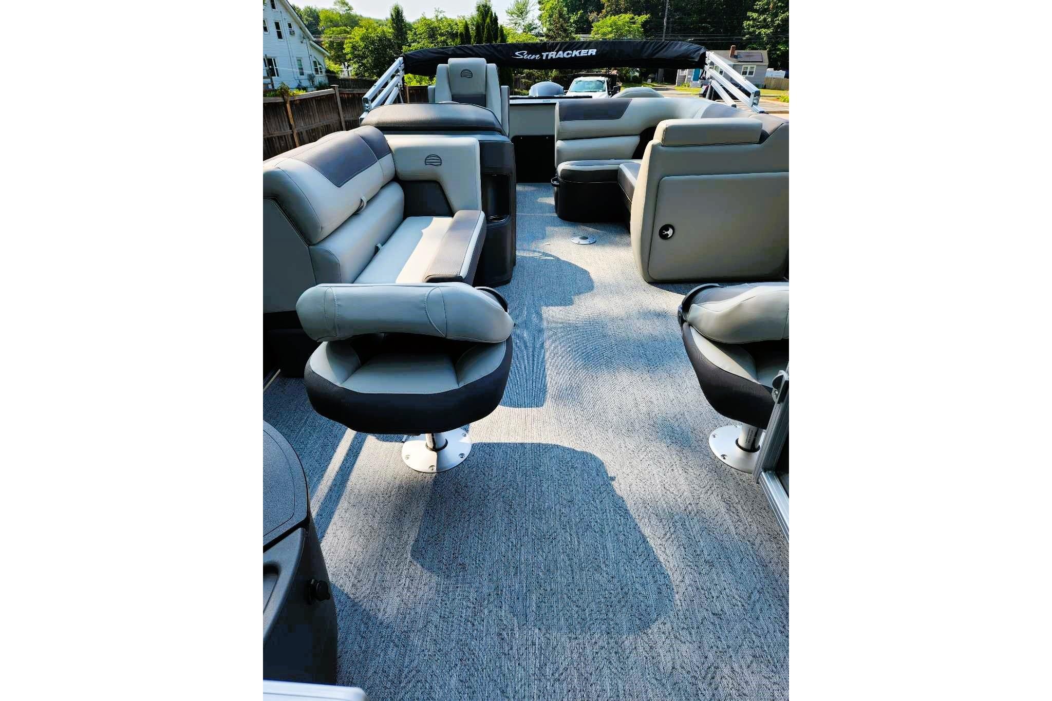 2026 Sun Tracker Fishin' Barge 20 DLX interior with comfortable seating and spacious layout.